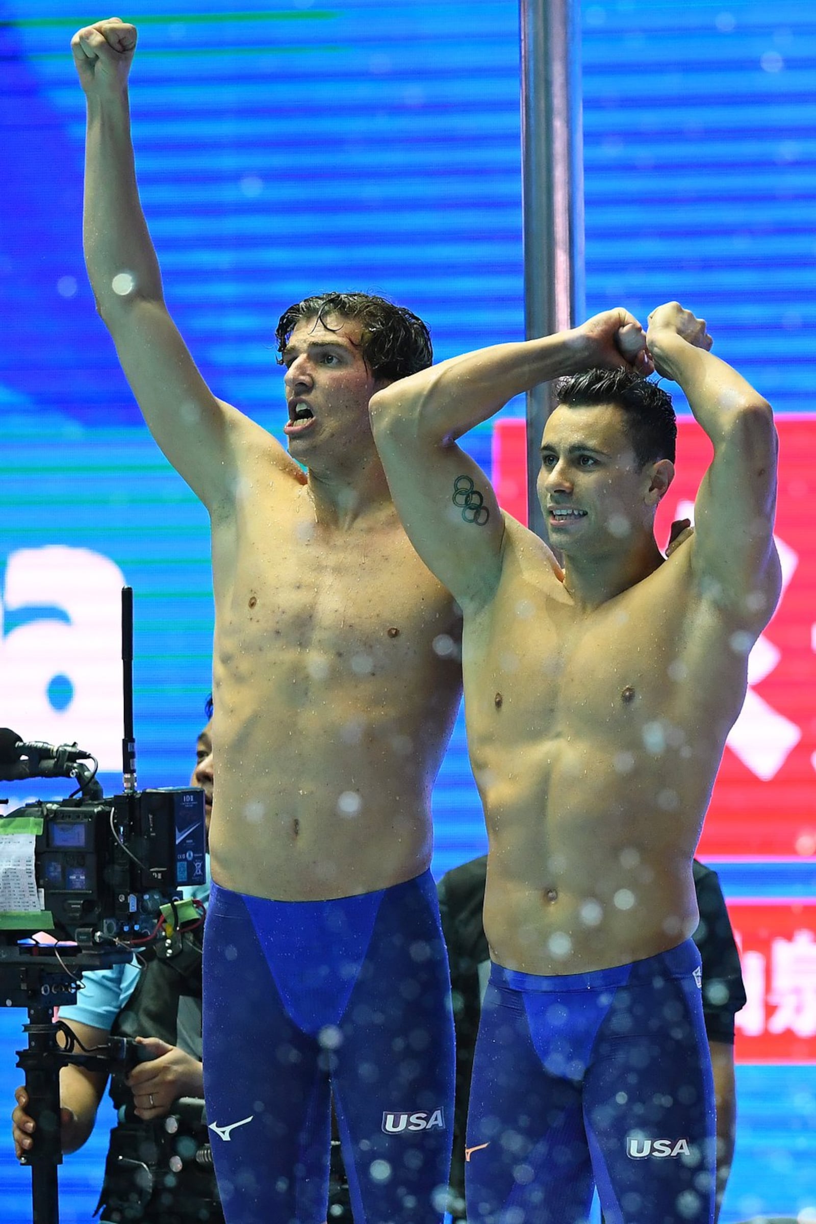 GWANGJU, SOUTH KOREA - JULY 21: Team USA (L-R) Zach Apple and Blake Pieroni reacts after setting a Championship Record of 3:09.21 in the Men’s 4x100m Freestyle Final on day one of the Gwangju 2019 FINA World Championships at Nambu International Aquatics Centre on July 21, 2019 in Gwangju, South Korea. (Photo by Quinn Rooney/Getty Images)