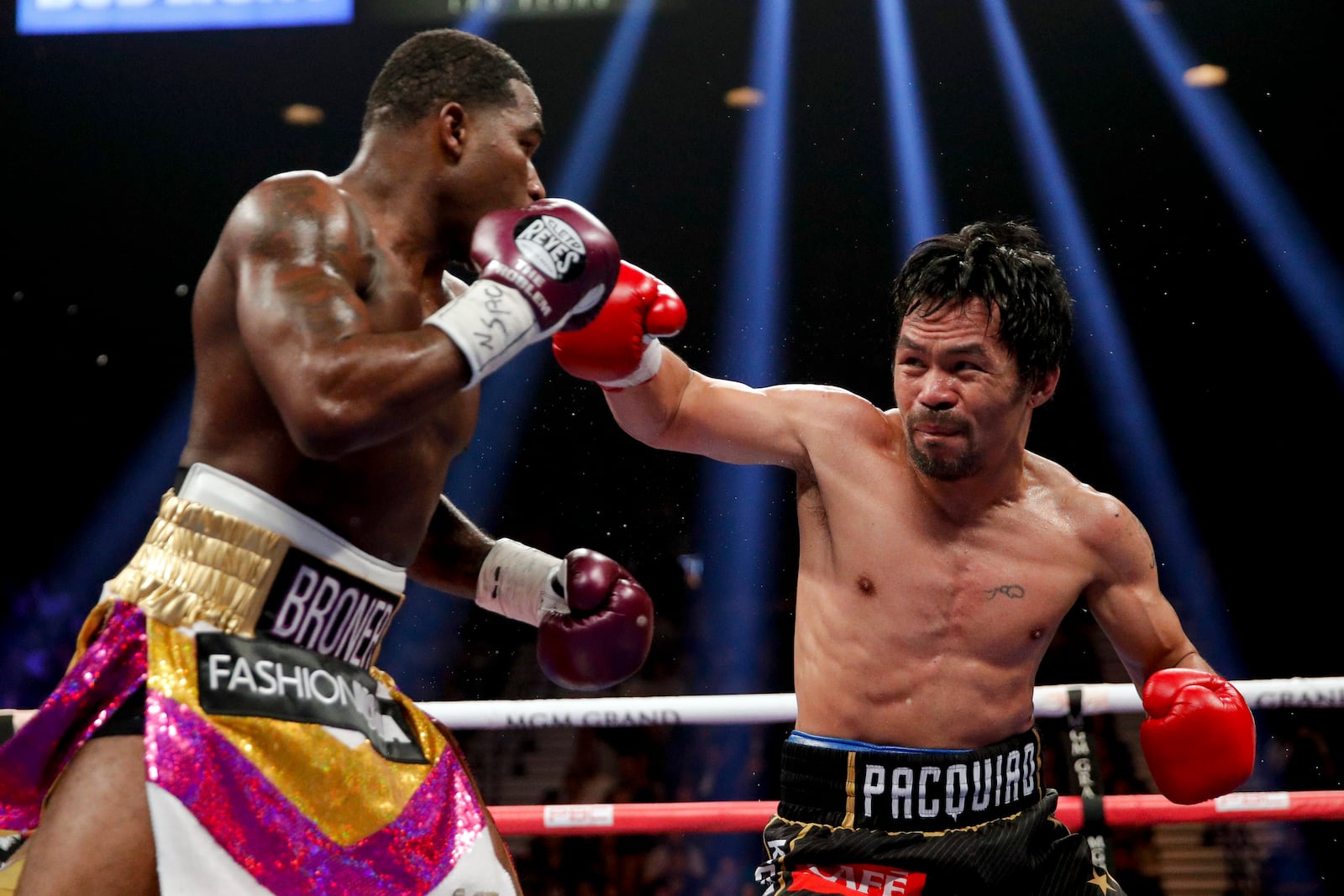 FILE - Manny Pacquiao, right, throws a right to Adrien Broner in the WBA welterweight title boxing match Saturday, Jan. 19, 2019, in Las Vegas. (AP Photo/John Locher, File)