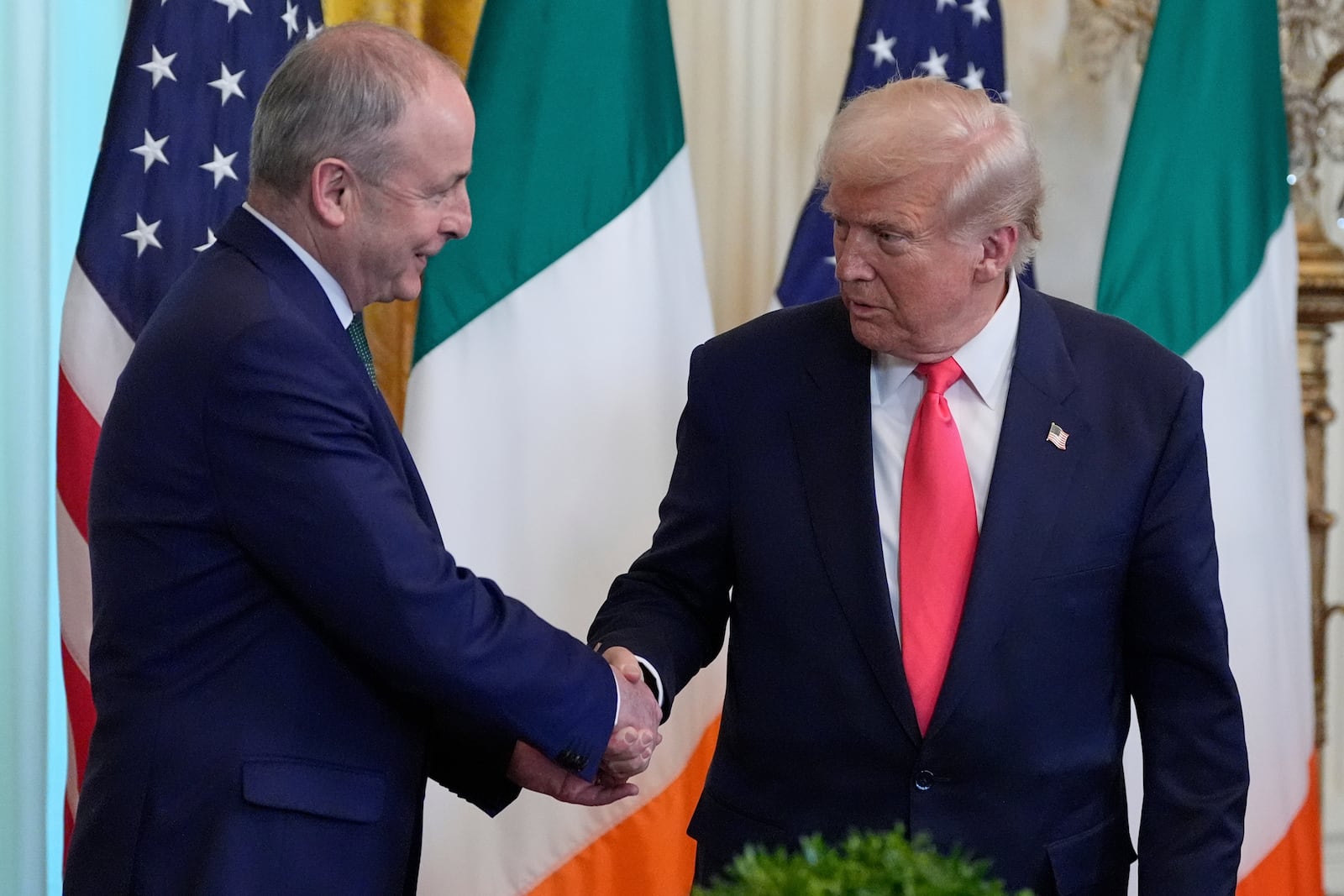 Ireland's Prime Minister Micheál Martin shakes hands with President Donald Trump during an event in the East Room of the White House in Washington, Wednesday, March 12, 2025. (AP Photo/Alex Brandon)