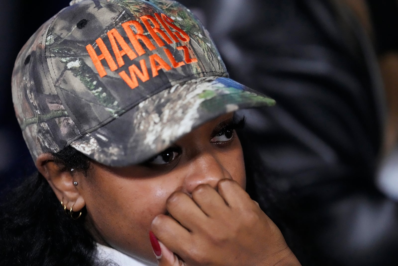 A supporter waiting during an election night campaign watch party for Democratic presidential nominee Vice President Kamala Harris on Tuesday, Nov. 5, 2024, on the campus of Howard University in Washington. (AP Photo/Ben Curtis)