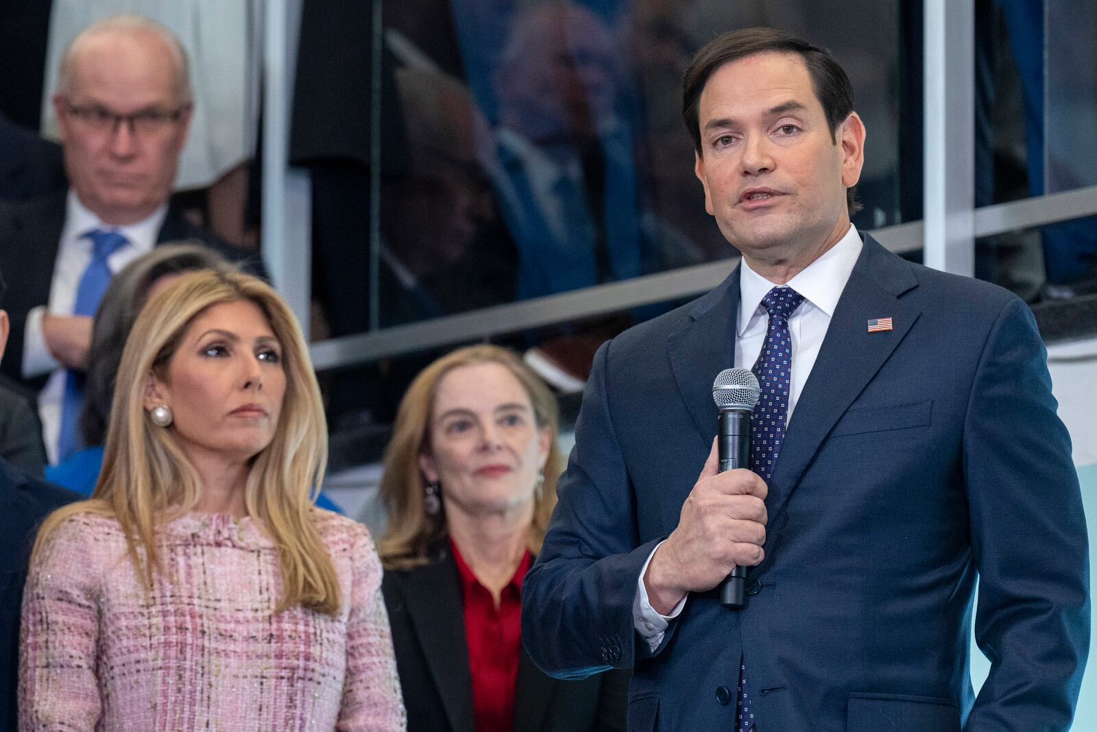 Secretary of State Marco Rubio speaks to State Department staff while next to his family including wife Jeanette Dousdebes Rubio, at left, at the State Department, Tuesday, Jan. 21, 2025, in Washington. (AP Photo/Jacquelyn Martin)