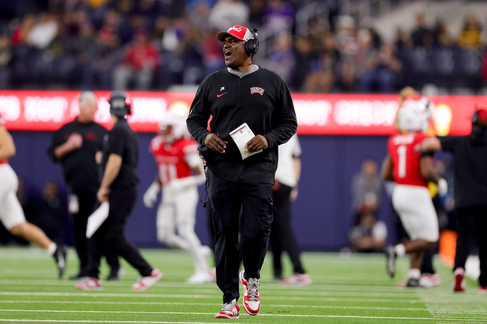 UNLV interim head coach Del Alexander reacts on the sideline during the second half of the LA Bowl NCAA college football game against California Wednesday, Dec. 18, 2024, in Inglewood, Calif. (AP Photo/Ryan Sun)