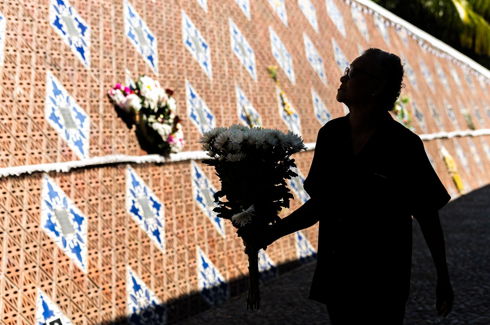 A relative of a victim of a 2004 Indian Ocean tsunami participates in its 20th anniversary at Tsunami Memorial Park at Ban Nam Khem, Takuapa district of Phang Nga province, southern Thailand, Thursday, Dec. 26, 2024. (AP Photo/Wason Wanichakorn)