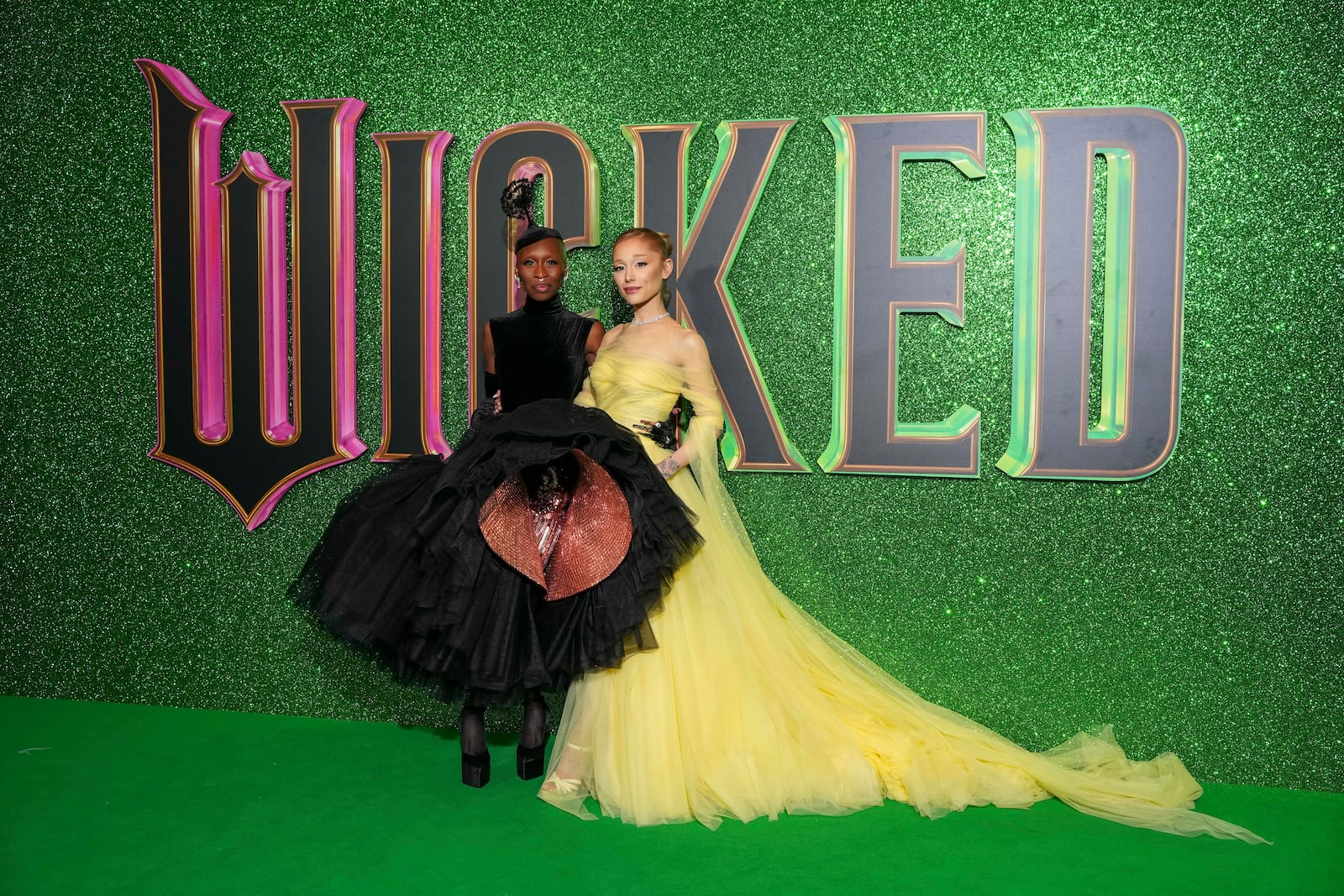 Cynthia Erivo, left, and Ariana Grande pose for photographers upon arrival at the premiere of the film 'Wicked' on Monday, Nov. 18, 2024, in London. (Photo by Scott A Garfitt/Invision/AP)