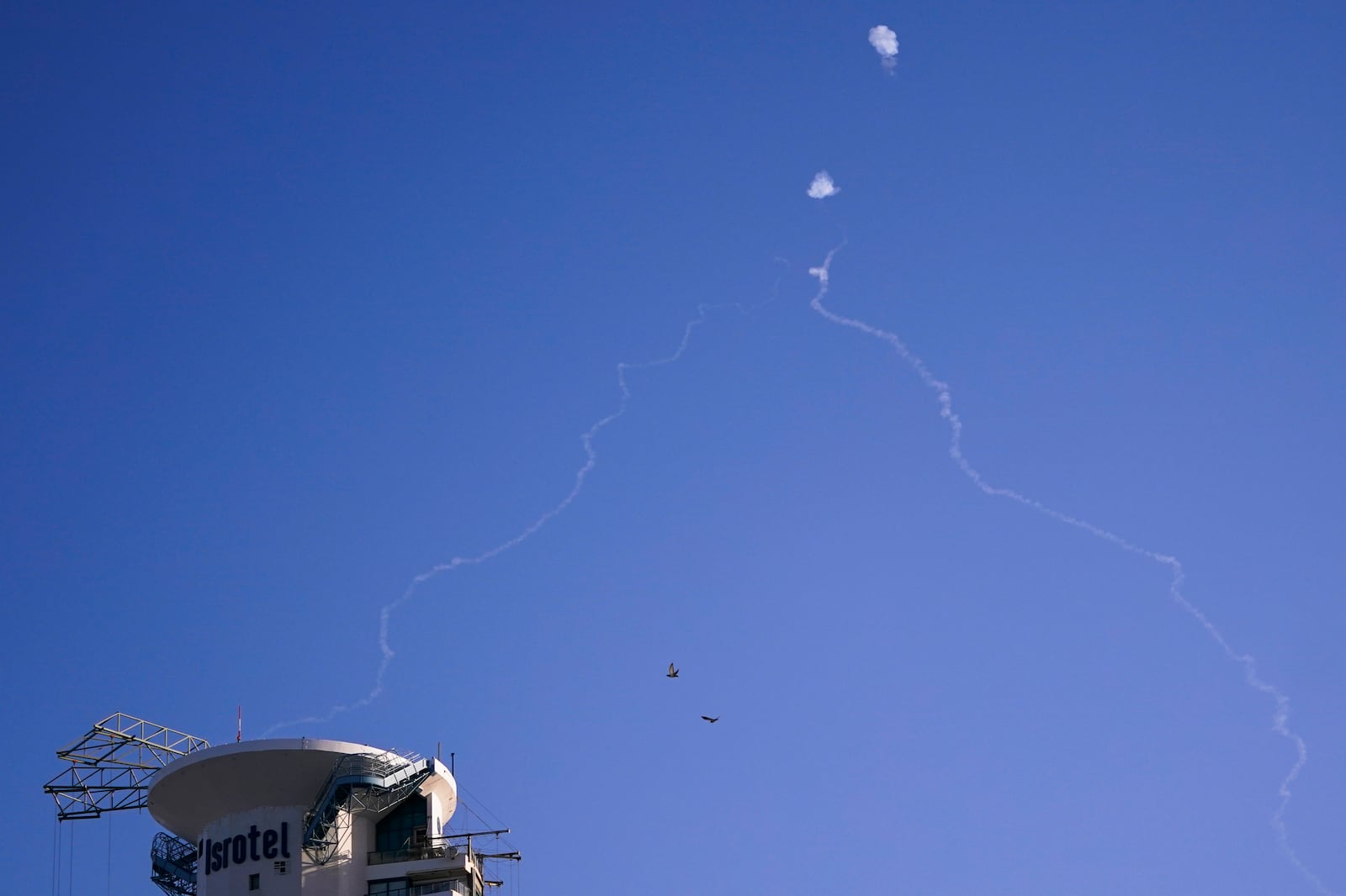 Israel's Iron Dome anti-missile system fires to intercept as air raid sirens sound in Tel Aviv, Wednesday, Oct. 23, 2024. (Nathan Howard/Pool Photo via AP)