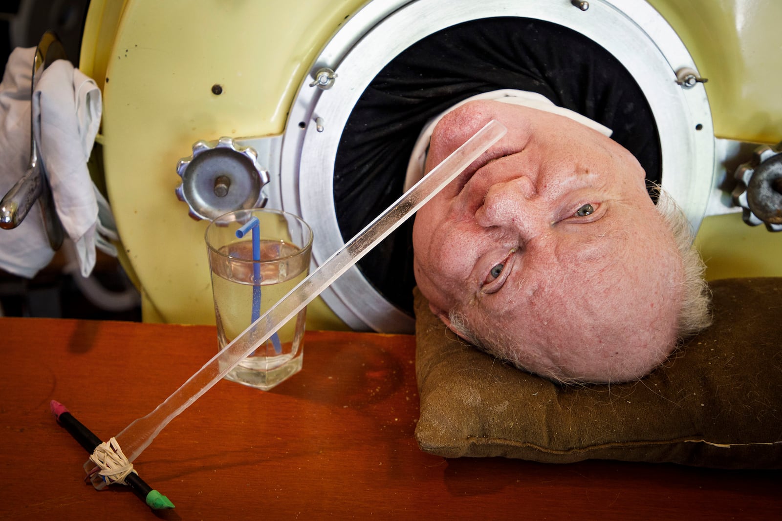 FILE - Attorney Paul Alexander looks out from inside his iron lung at his home in Dallas, April 27, 2018. (Smiley N. Pool/The Dallas Morning News via AP, File)