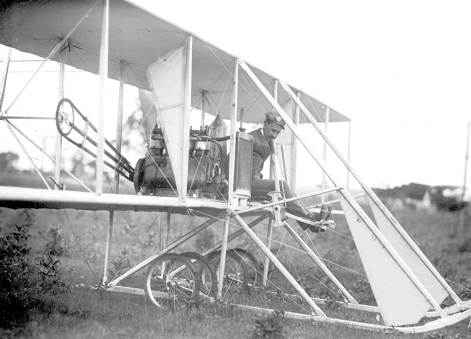 Orville Wright is at the controls of the Wright Model B in 1910 at Huffman Prairie. Photo by William Mayfield from the Marvin Christian Collection