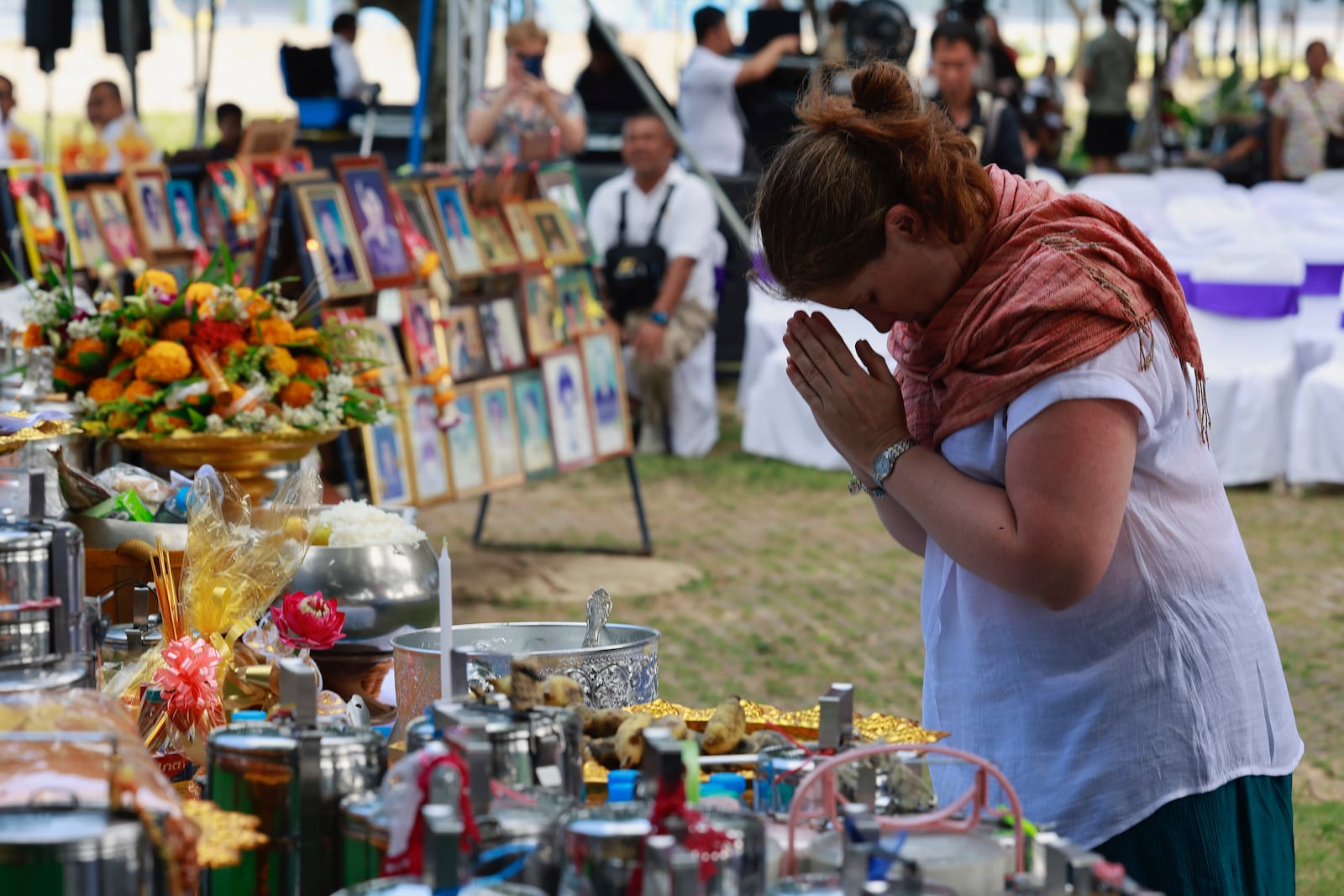 A relative of a victim of a 2004 Indian Ocean tsunami participates in its 20th anniversary at Tsunami Memorial Park at Ban Nam Khem, Takuapa district of Phang Nga province, southern Thailand, Thursday, Dec. 26, 2024. (AP Photo/Wason Wanichakorn)