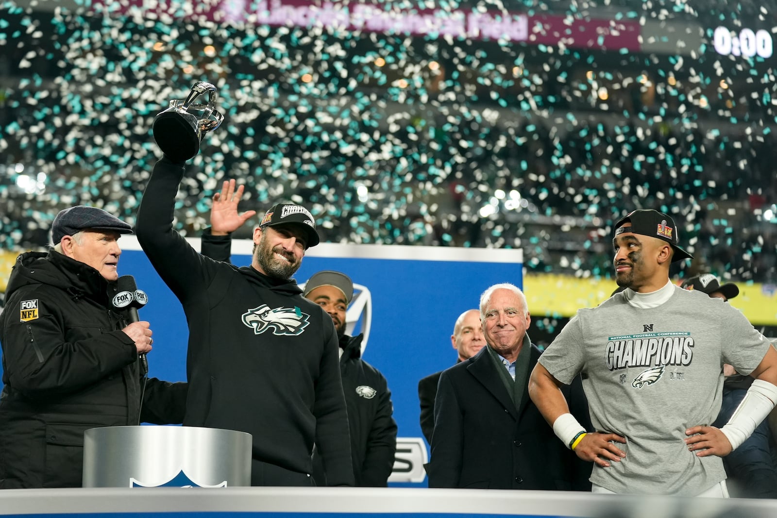 Philadelphia Eagles head coach Nick Sirianni celebrates with the trophy after their win against the Washington Commanders in the NFC Championship NFL football game, Sunday, Jan. 26, 2025, in Philadelphia. (AP Photo/Seth Wenig)