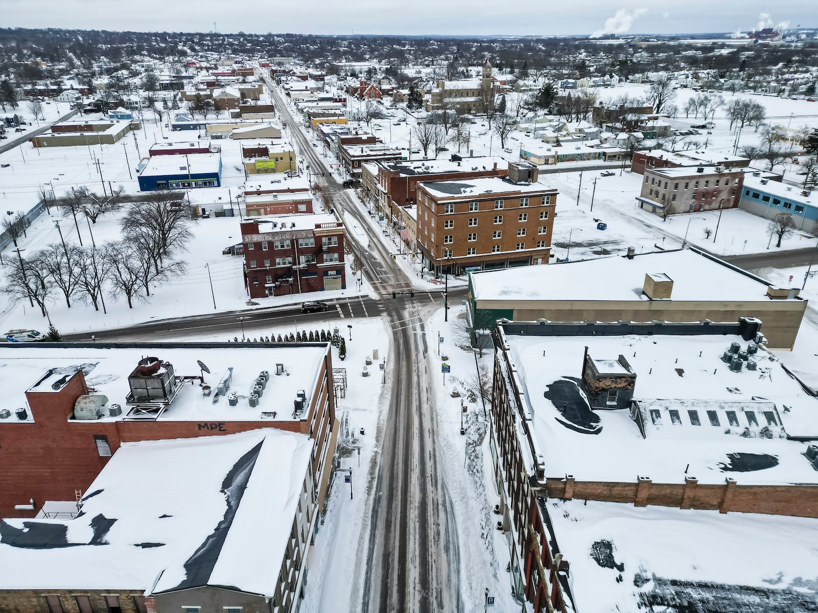 The main streets were plowed and treated with many side streets still snow cover after of several rounds of snowfall Monday afternoon, Jan. 6, 2025 in downtown Middletown. NICK GRAHAM/STAFF