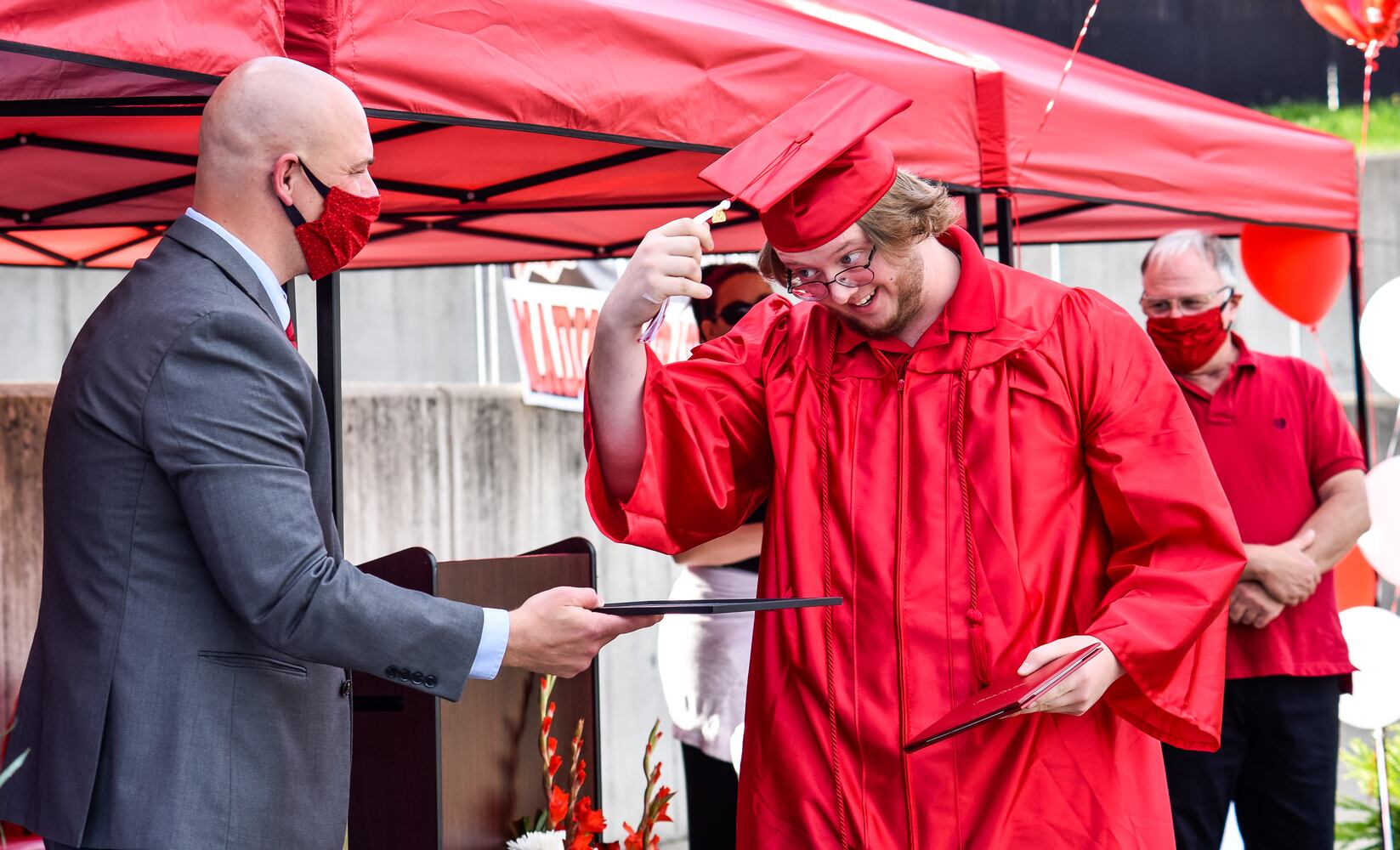 Madison High School drive-thru graduation ceremony at Land of Illusion