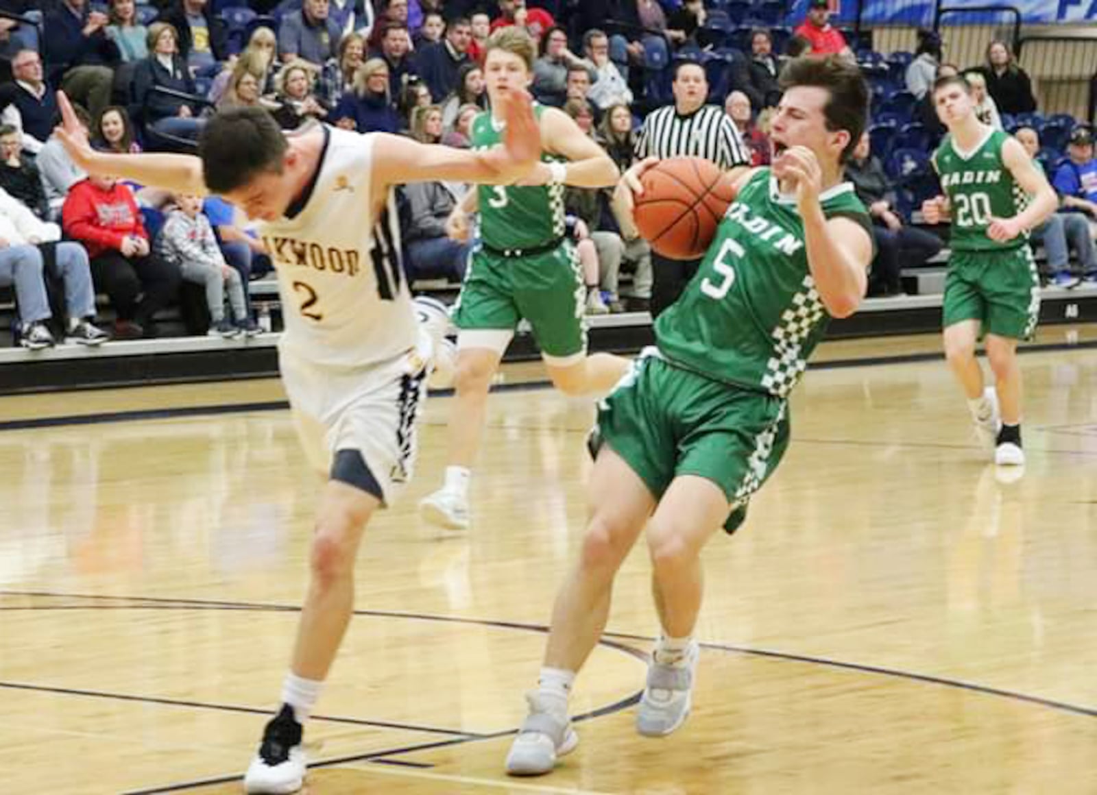 Badin’s Donovan Watkins (5) comes together with Oakwood’s Jack Armstrong (5) on a play during Tuesday night’s Division II sectional basketball game at Fairmont’s Trent Arena. Badin won 65-55. CONTRIBUTED PHOTO BY TERRI ADAMS