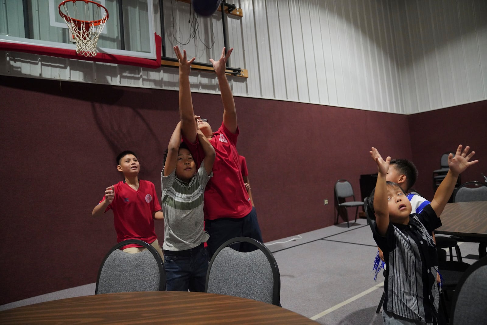 Young congregants play catch after a Karen-language service at Indian Lake Baptist Church, in Worthington, Minn., on Sunday Oct. 20, 2024. (AP Photo/Jessie Wardarski)