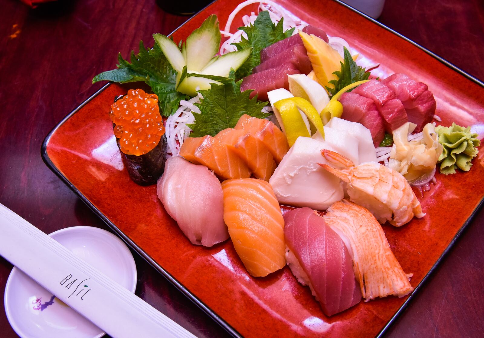 The Sushi and Sashimi sampler is displayed Wednesday, Jan. 17 at Basil 1791 that is now open on High Street in Hamilton. Basil 1791 offers a variety of dishes from sushi to traditional American fare. NICK GRAHAM/STAFF