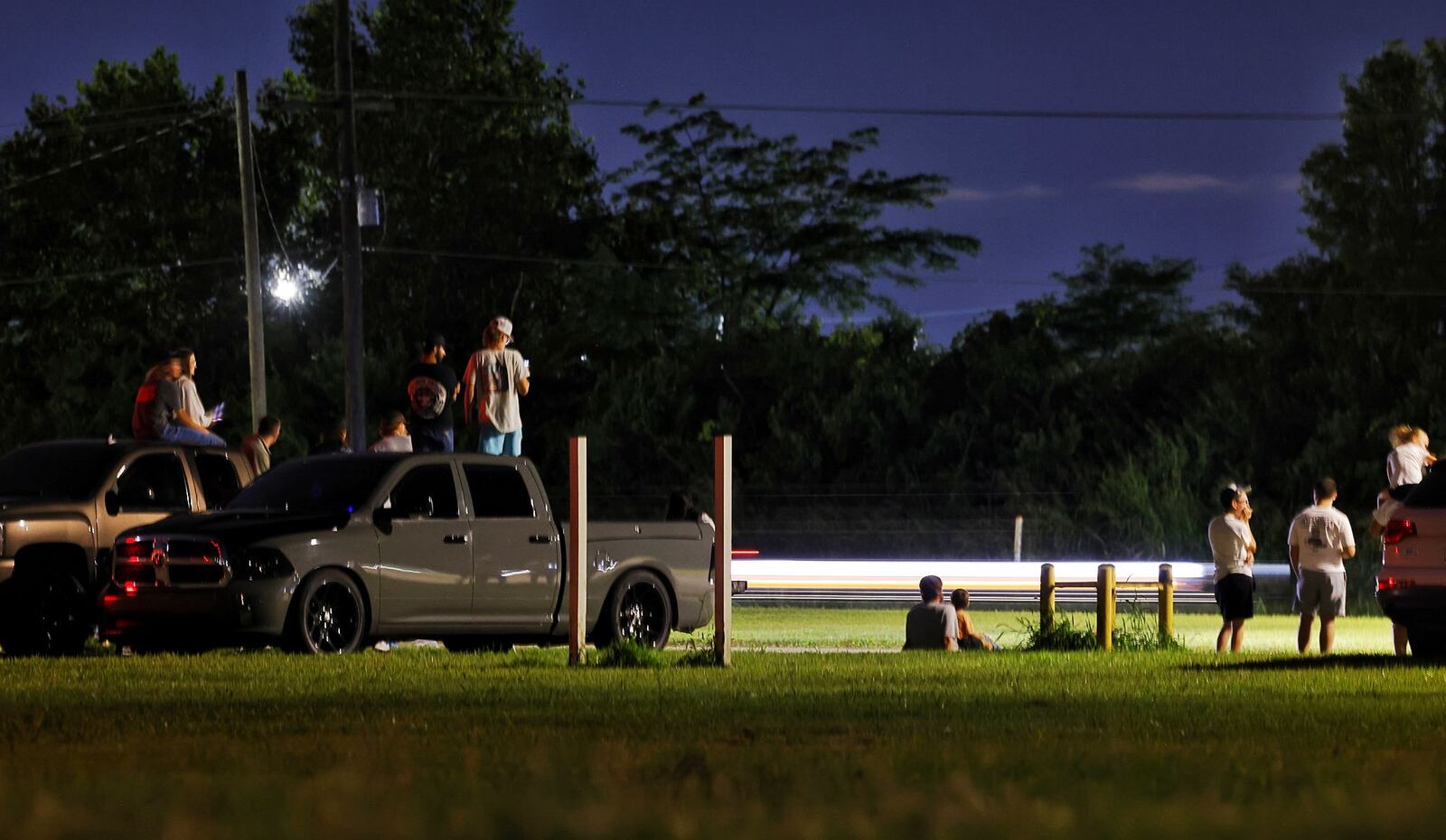 Car enthusiasts gather in a parking lot along S Breiel Blvd. near Caprice Drive Saturday night, Aug. 17, 2024 in Middletown. The area is popular cruising spot. NICK GRAHAM/STFF