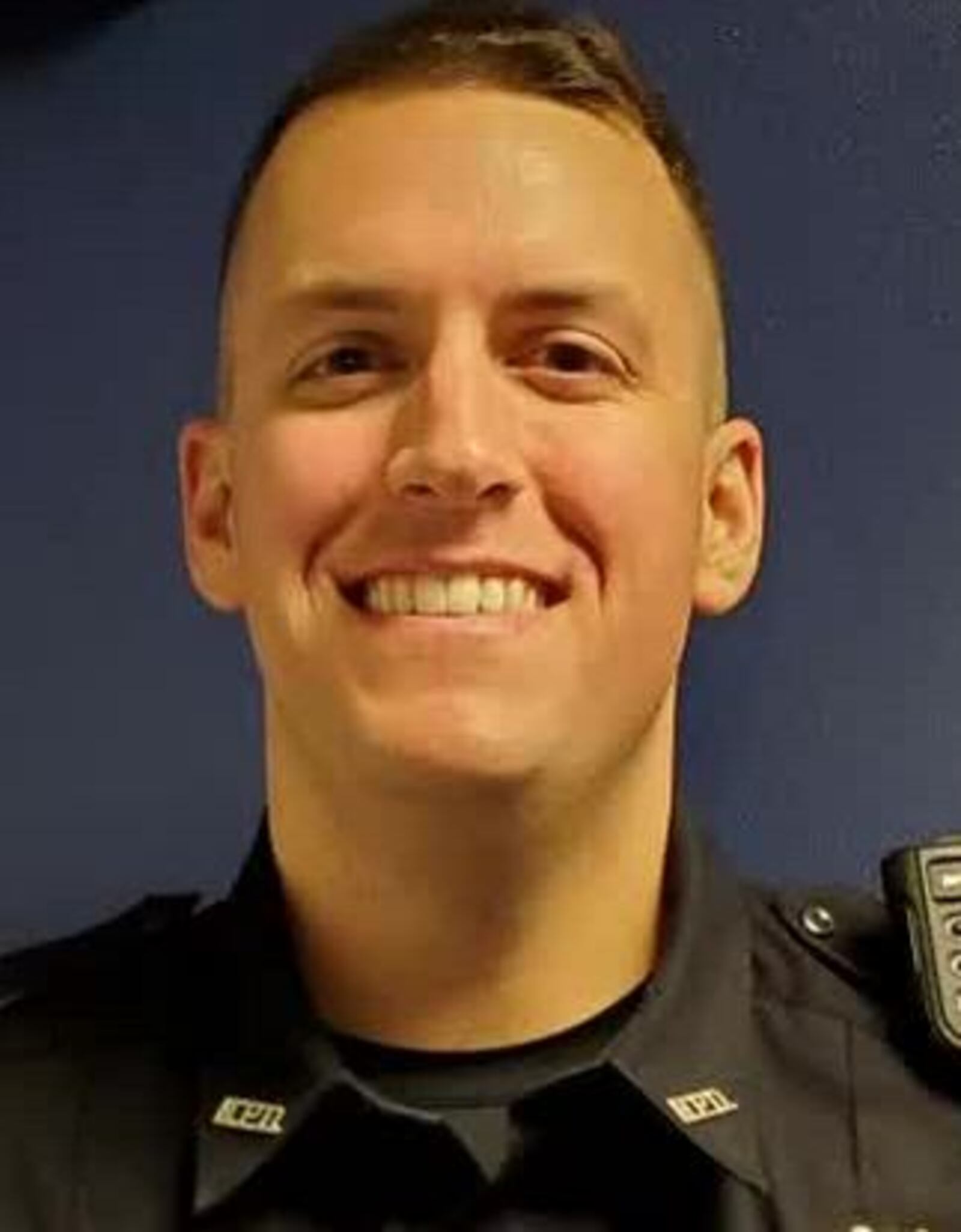 Middletown officer Adam Grindstaff entered a burning house and helped rescue a woman who was trapped in the kitchen.