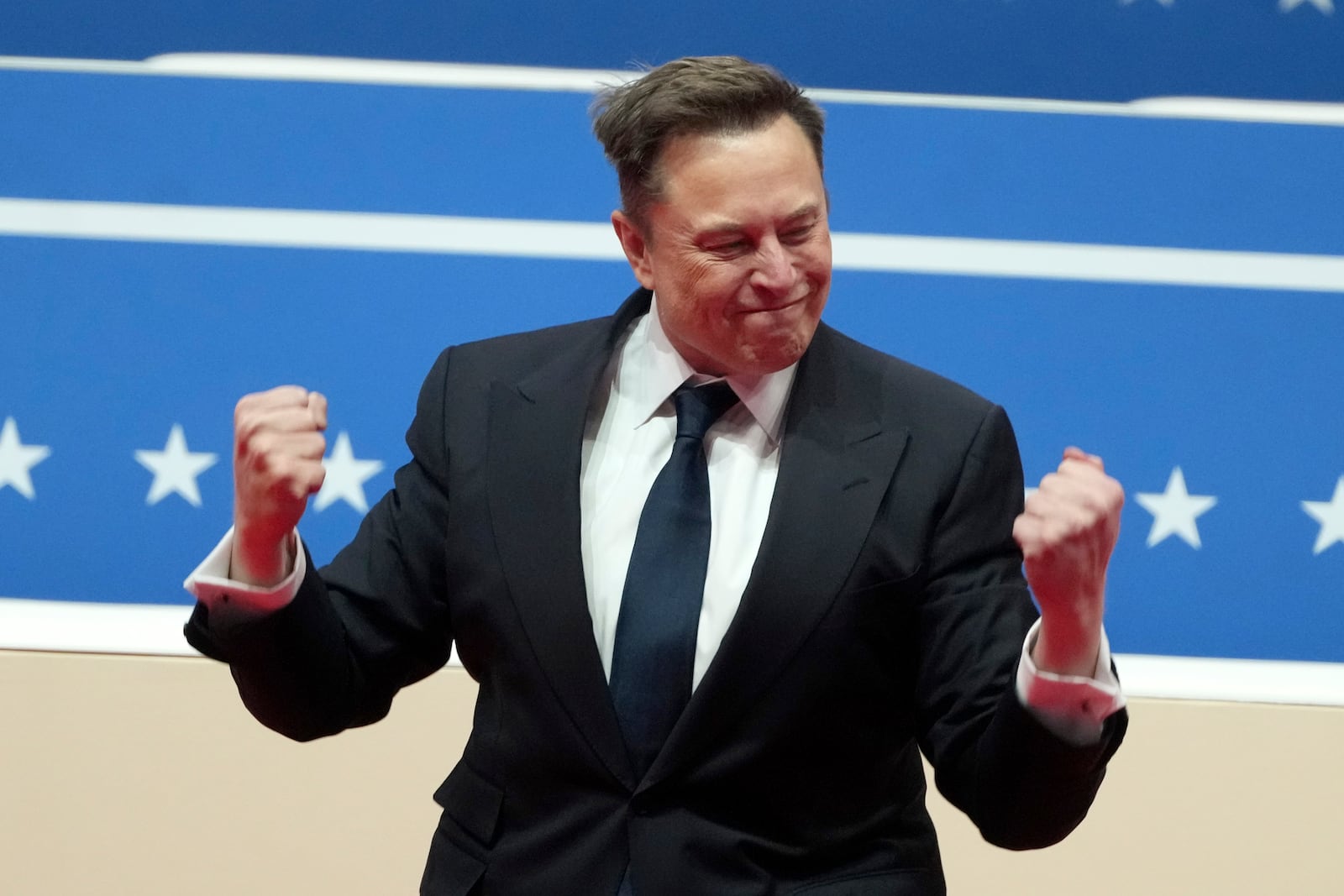 Elon Musk arrives to speak at an indoor Presidential Inauguration parade event in Washington, Monday, Jan. 20, 2025. (AP Photo/Matt Rourke)