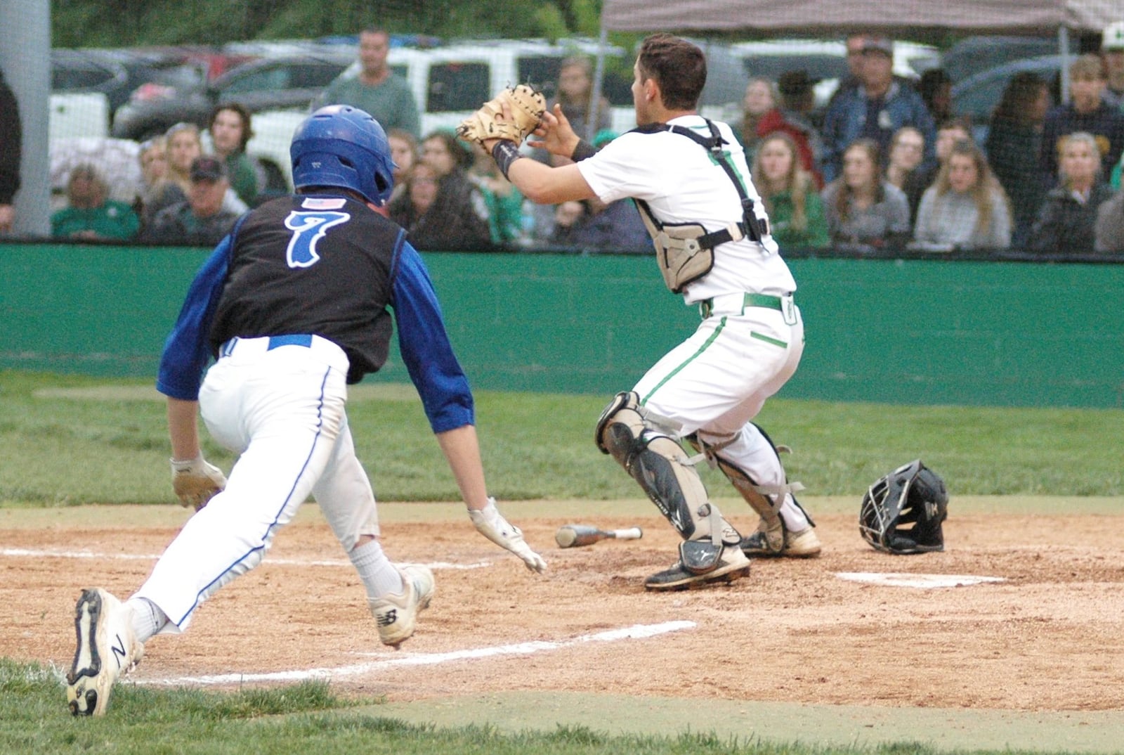 Hamilton’s Devin Fath (7) is about to be safe at home plate ahead of the throw to Badin catcher Dylan Ballauer on Saturday night at Alumni Field. Host Badin won 9-7. RICK CASSANO/STAFF