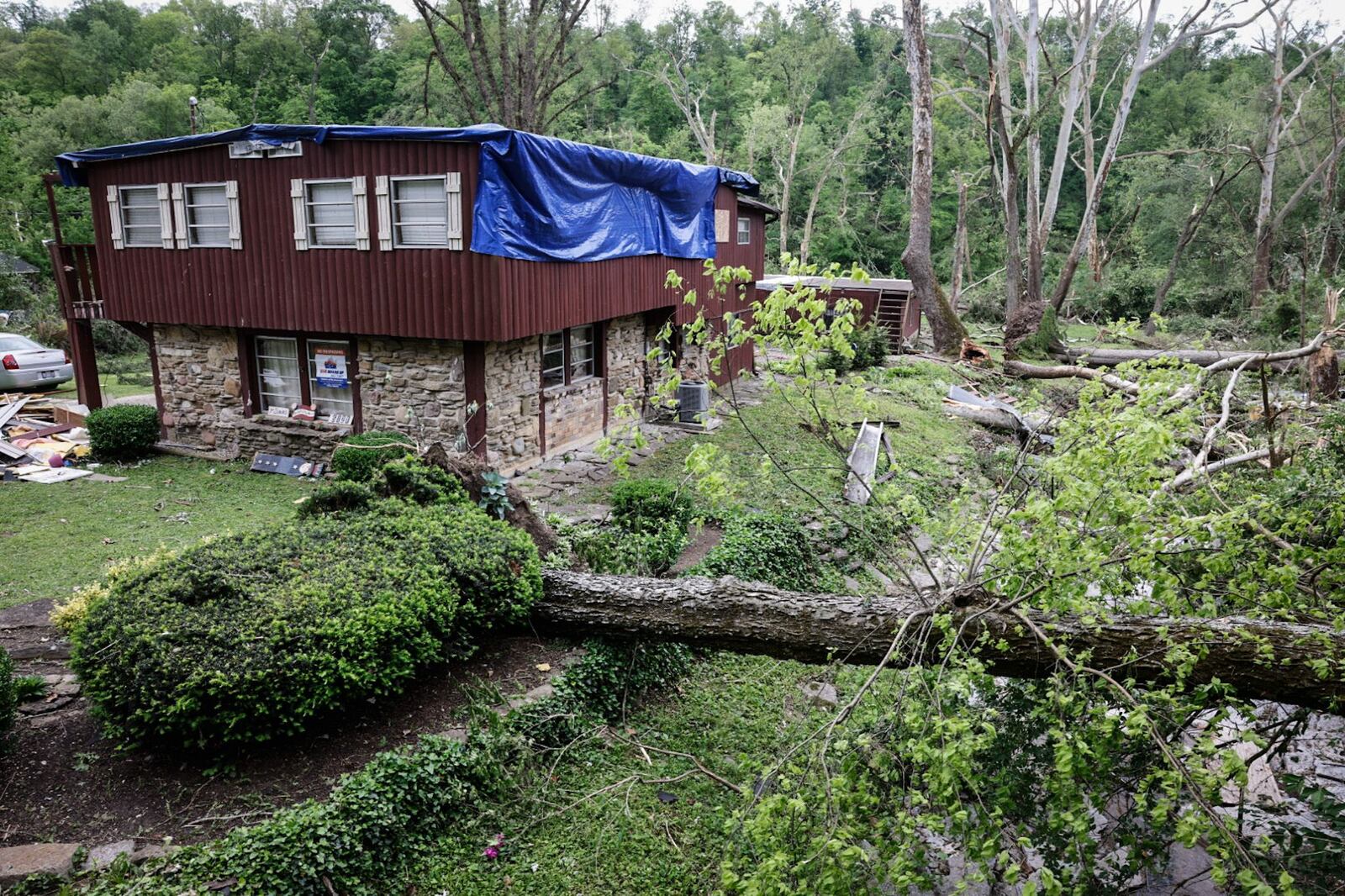 A house along Mason-Morrow-Millgrove Road in Warren County was damaged by fallen trees after a tornado ripped though the area Tuesday evening, May 7, 2024. JIM NOELKER/STAFF