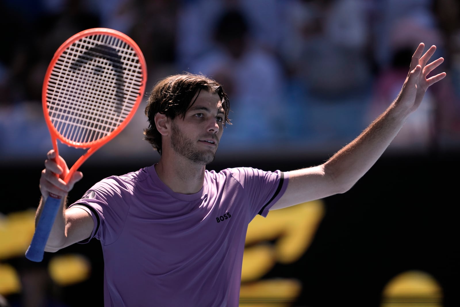 Taylor Fritz of the U.S. celebrates after defeating Cristian Garin of Chile in their second round match at the Australian Open tennis championship in Melbourne, Australia, Thursday, Jan. 16, 2025. (AP Photo/Ng Han Guan)