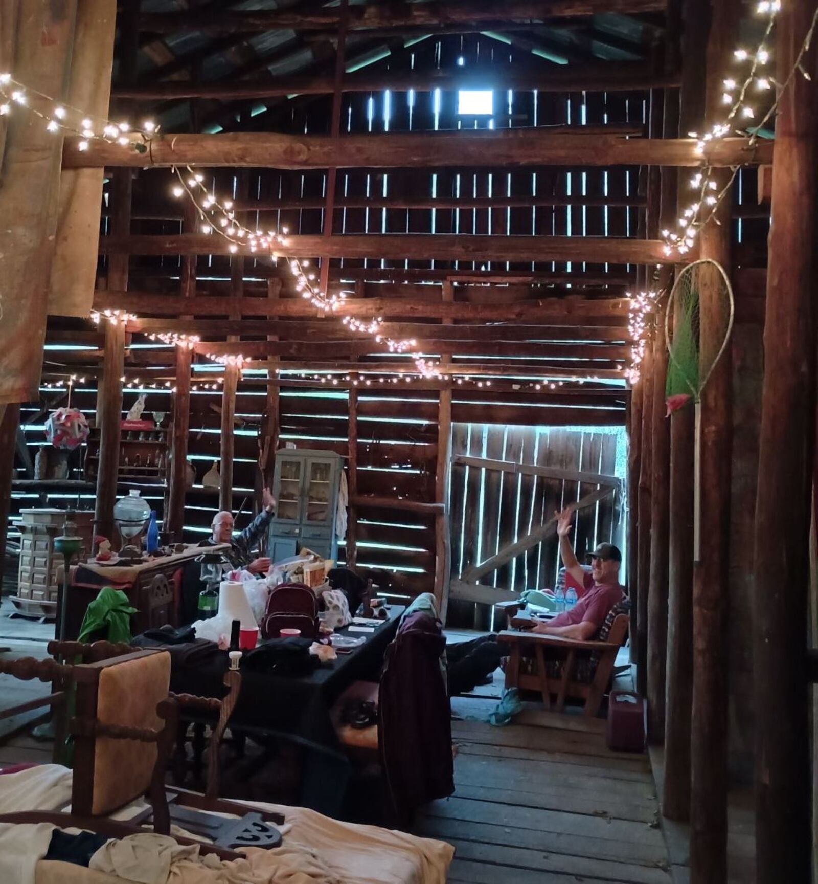 Lindsay and Erik Augustin of Springfield relax with Erik’s parents, Rick and Loretta, in the barn of a helpful family near Erwin, Tennessee, as they figure out how to get home in the aftermath of Hurricane Helene in late September, 2024.