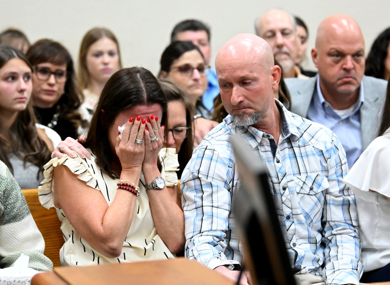 Allyson Phillips, left,, mother of Jose Ibarra, accused of killing a Georgia nursing student earlier this year reacts as John Phillips, stepfather of Jose Ibarra, comforts her during Ibarra's trial at Athens-Clarke County Superior Court, Friday, Nov. 15, 2024, in Athens, Ga. (Hyosub Shin/Atlanta Journal-Constitution via AP, Pool)