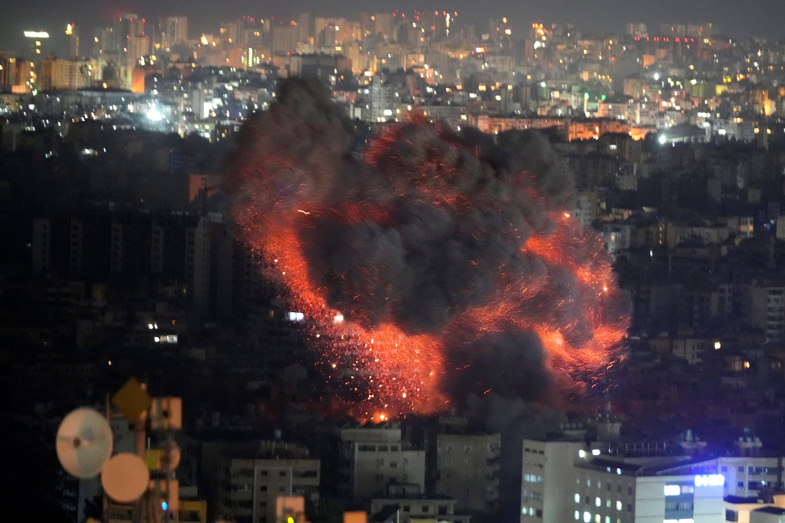 Flame and smoke rises from an Israeli airstrike on Dahiyeh, in the southern suburb of Beirut, Lebanon, early Sunday, Oct. 27, 2024. (AP Photo/Hussein Malla)