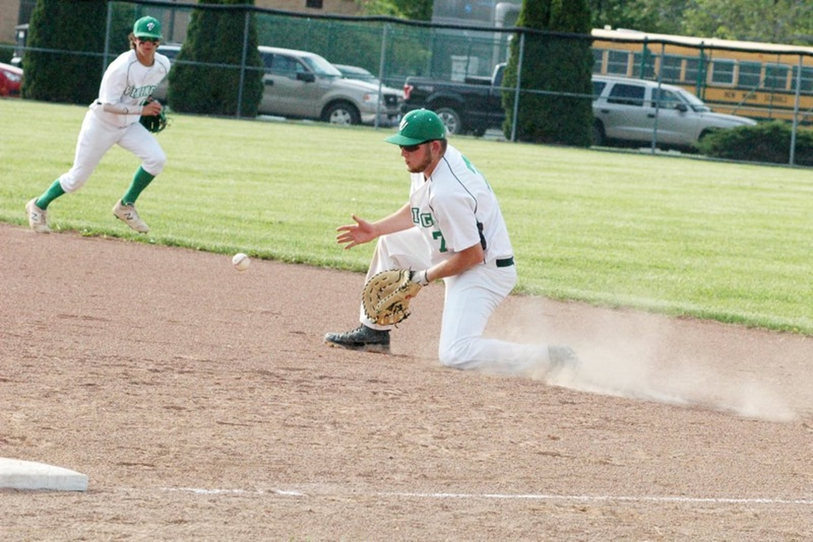 New Miami first baseman Ronnie Bowman goes down for a ground ball May 15 during a Division IV sectional baseball game against visiting Lockland. New Miami won 8-1. RICK CASSANO/STAFF