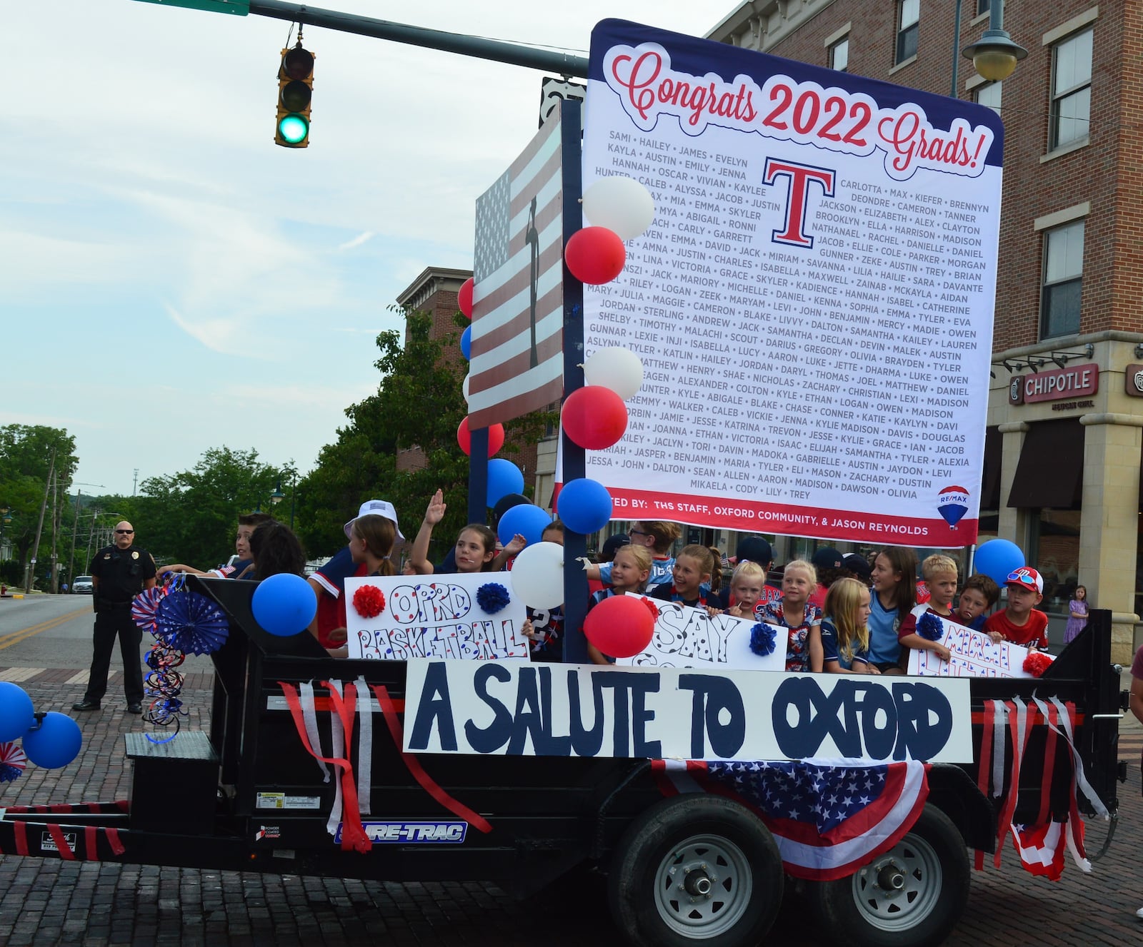 Parade prize winner in this year’s Freedom Fest celebration was realtor Jason Reynolds with his entry “Salute to Oxford” recognizing the Talawanda High School class of 2022 and youth in sports programs, such as basketball, SAY Soccer and Miami Little League. BOB RATTERMAN/CONTRIBUTED