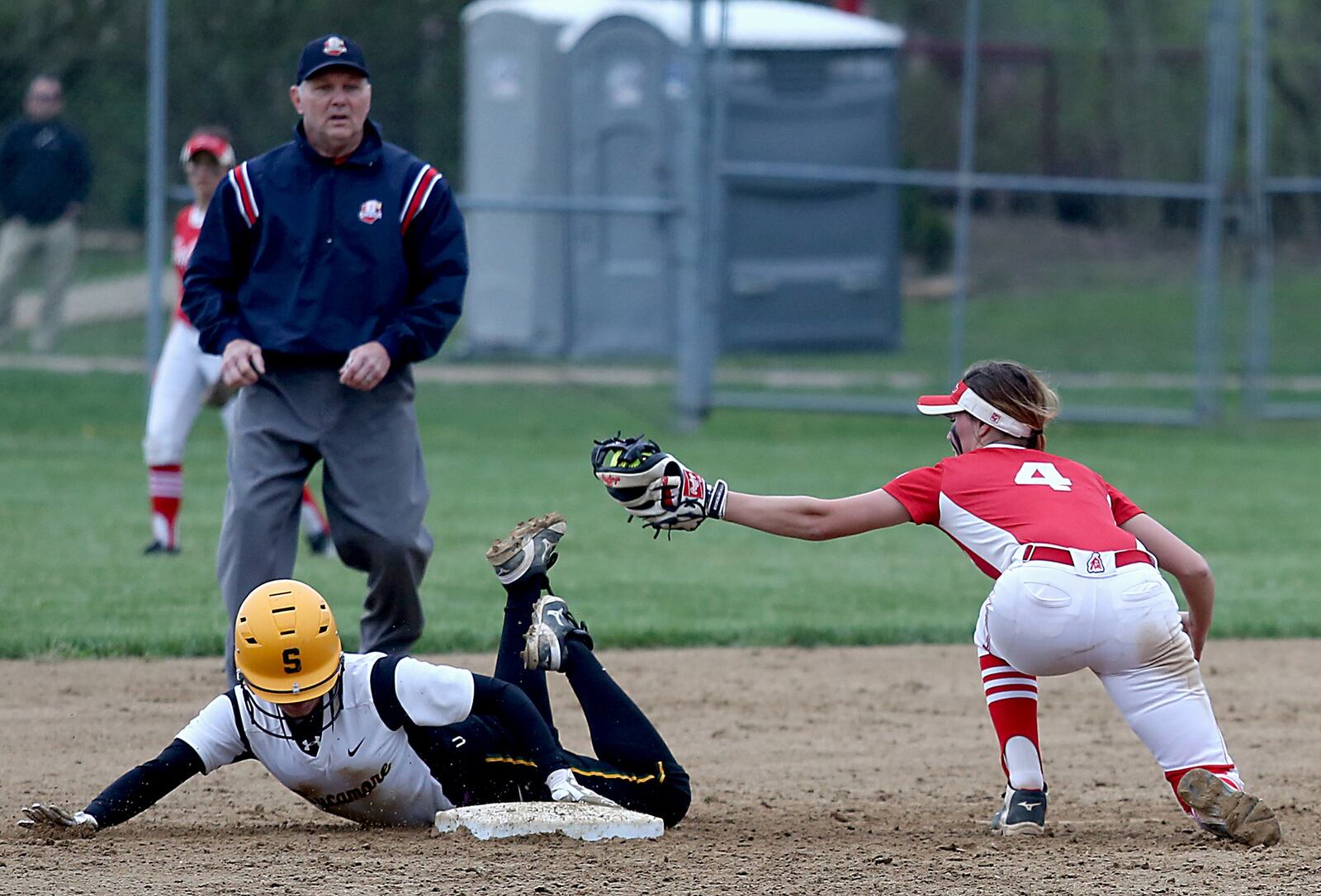 Sycamore’s Jessica Fehr steals second base as Fairfield shortstop Maddie Koger is late with the tag Tuesday at Fairfield Middle School. CONTRIBUTED PHOTO BY E.L. HUBBARD