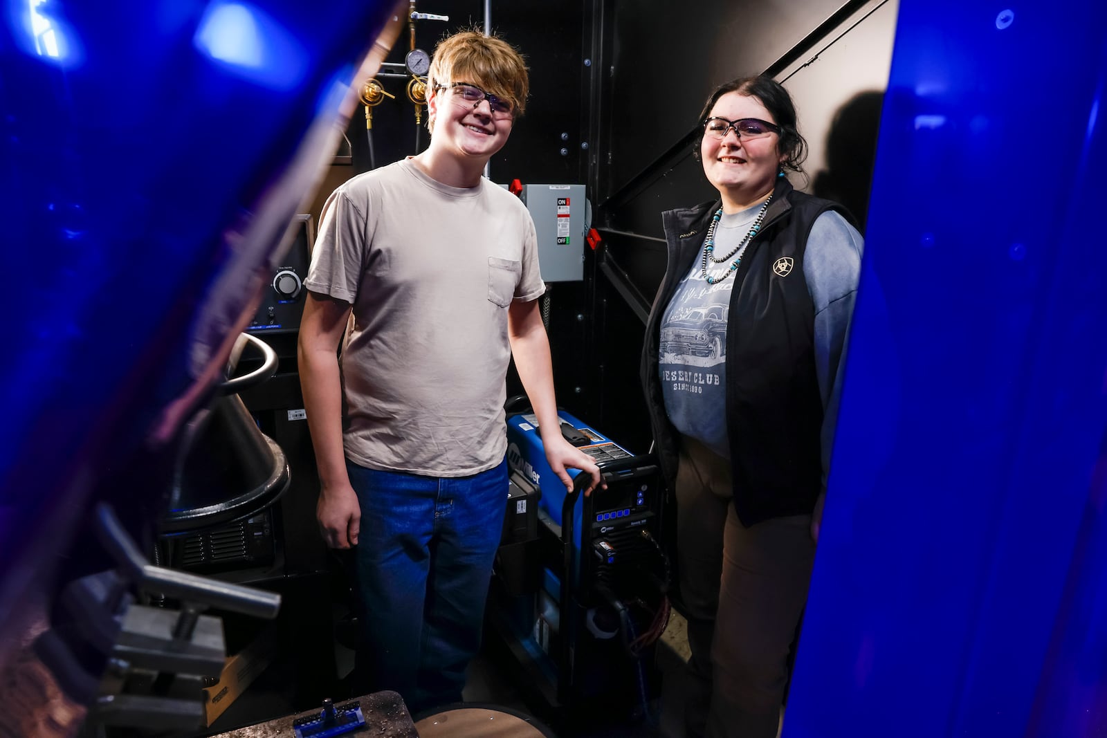 Senior welding students Landen Johnson, left, and Gabrielle Spoonmore give a tour of the facility during the ribbon cutting for the new welding lab at Butler Tech Thursday, Nov. 7, 2024. NICK GRAHAM/STAFF