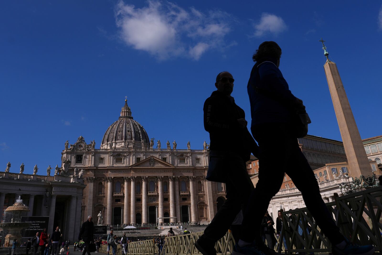 People visit St Peter's Square at The Vatican, Thursday, Feb. 27, 2025. (AP Photo/Kirsty Wigglesworth)