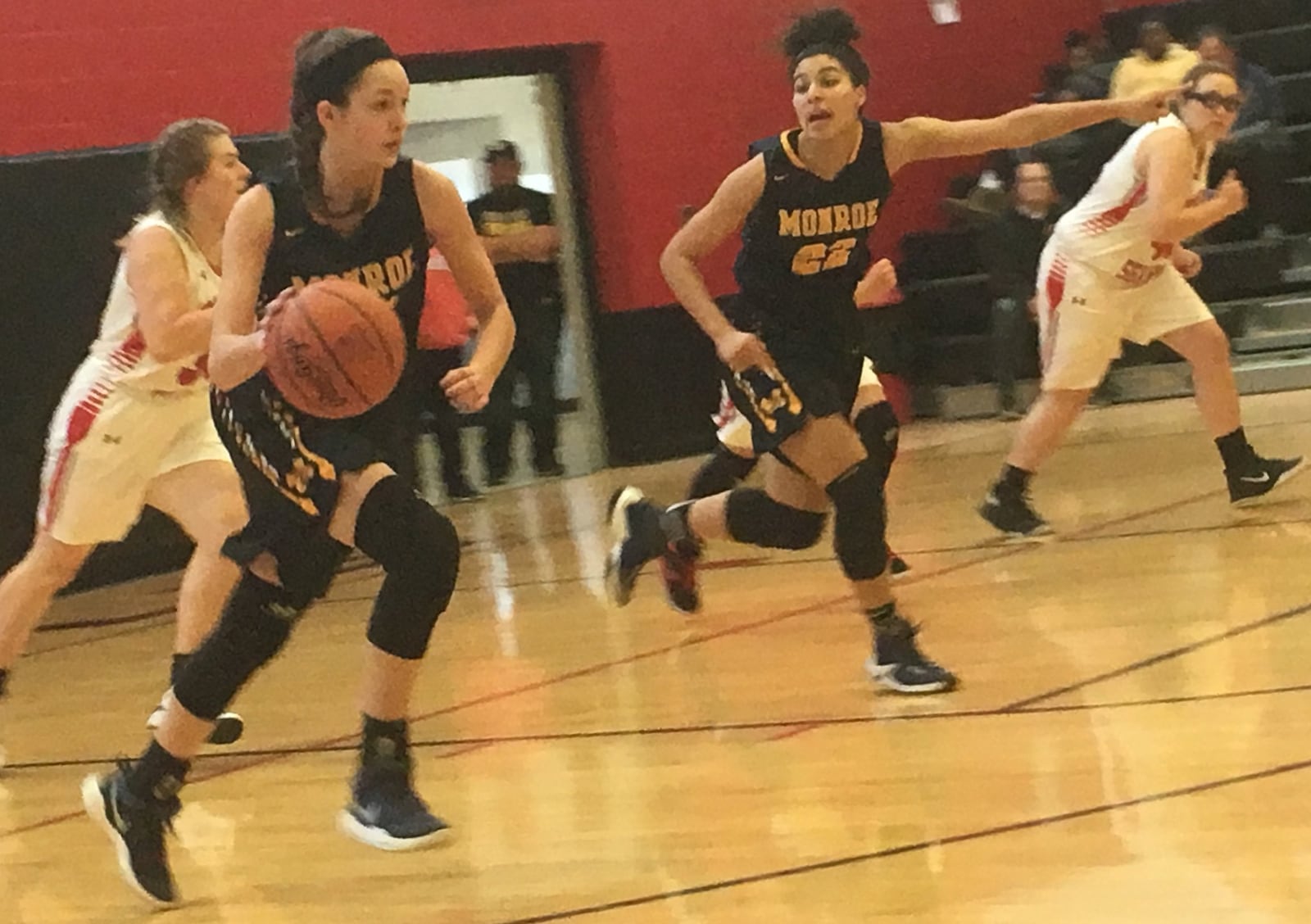 Monroe’s Rylen Carroll (25) leads the fast break as teammate Jahsalyn Robinson (22) provides assistance during Saturday afternoon’s game at Preble Shawnee. RICK CASSANO/STAFF