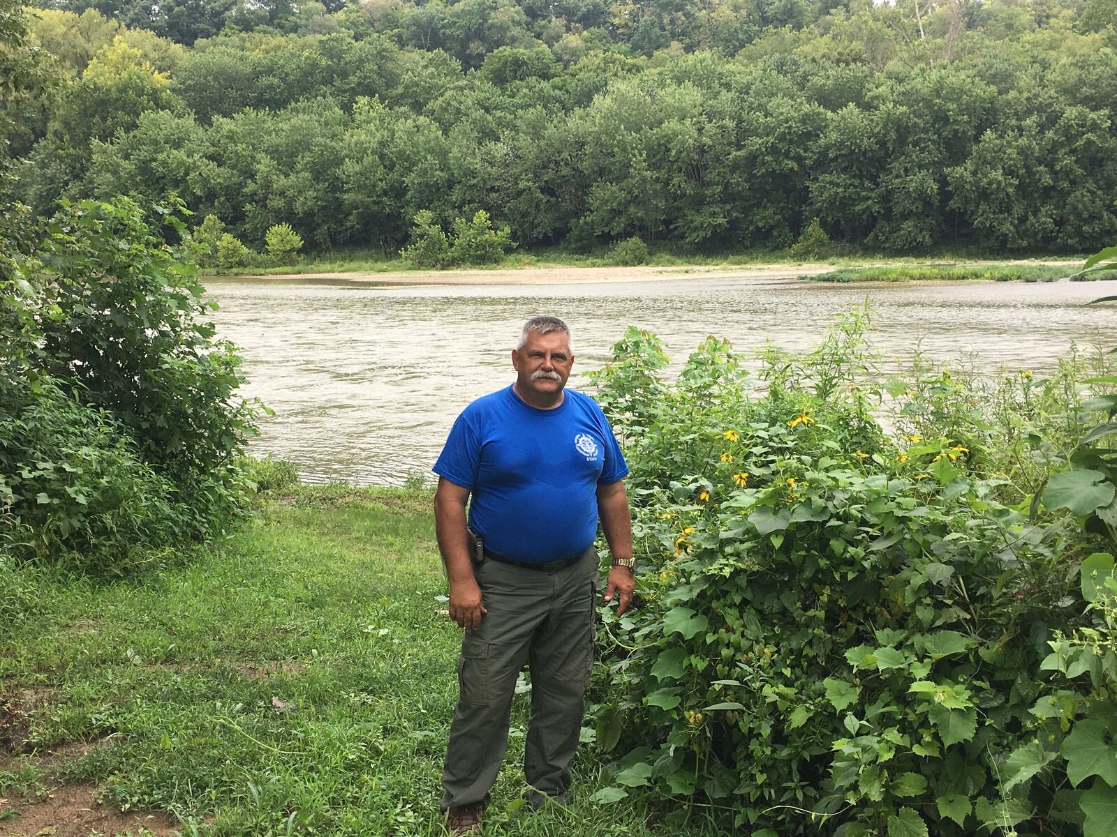 Troy Schwable, who with his wife, Kathy Schwable, is one of the leaders in creating Hamilton’s Riverside Natural Area, stands next to a canoe/kayak launch location near the city’s 33rd river mile. There are no dams downriver at this point, meaning someone can kayak or canoe unimpeded to the Ohio River from the location. MIKE RUTLEDGE/STAFF