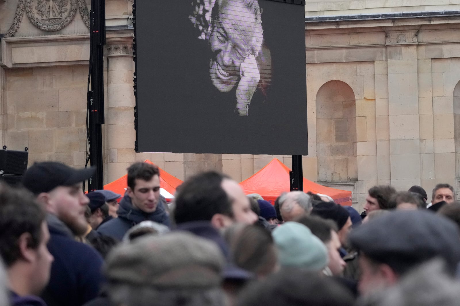 People wait outside Notre Dame du Val-de-Grace church before a public memorial for late far-right leader Jean-Marie Le Pen, Thursday, Jan. 16, 2025 in Paris. Jean-Marie Le Pen, the founder of France's main far-right party, died on Jan.7, 2025 aged 96. (AP Photo/Michel Euler)