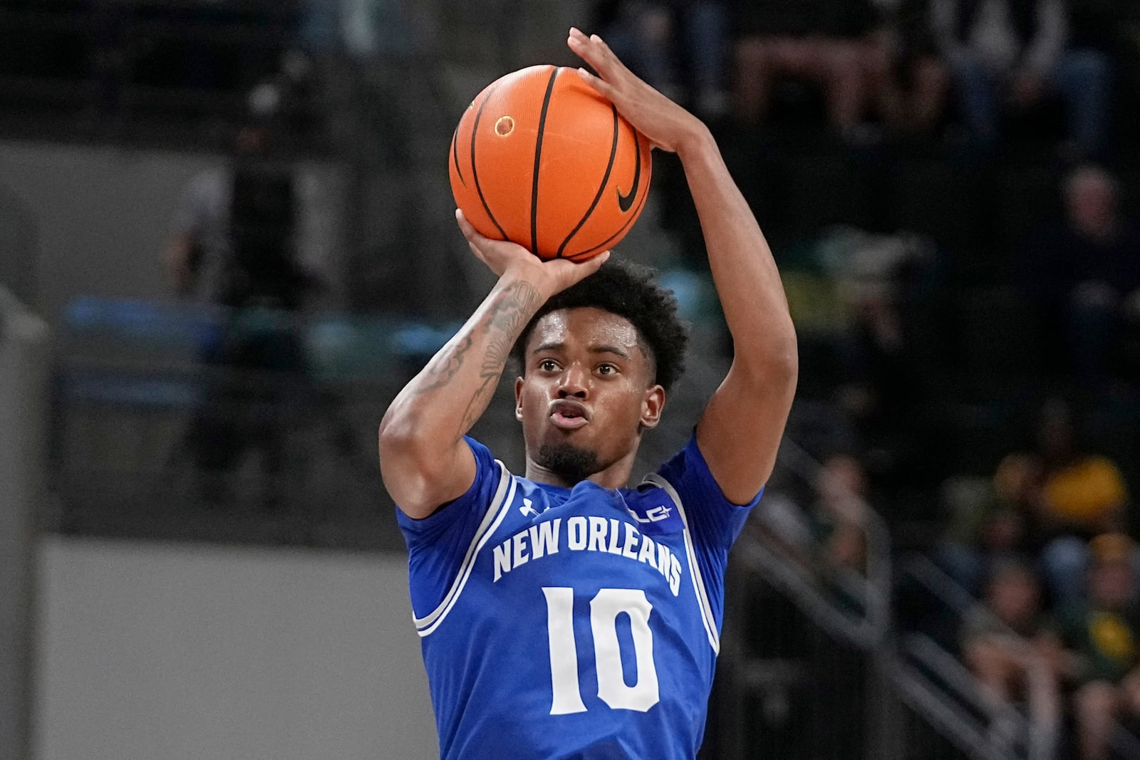 FILE - New Orleans guard Dae Dae Hunter shoots and sinks a 3-point basket in the second half of an NCAA college basketball game against Baylor, Wednesday, Nov. 27, 2024, in Waco, Texas. (AP Photo/Tony Gutierrez)