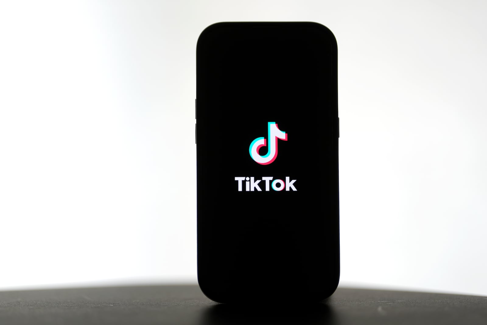 A TikTok logo is shown on a phone in San Francisco, Friday, Jan. 17, 2025. (AP Photo/Jeff Chiu)