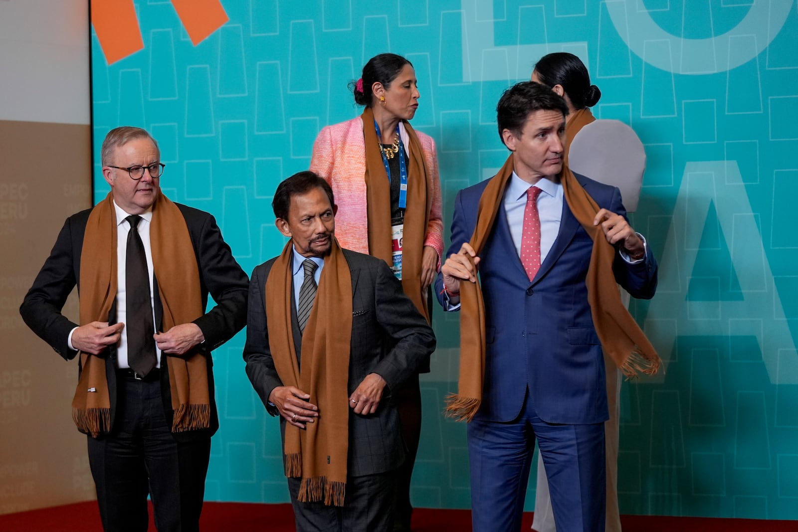 From left, Australia's Prime Minister Anthony Albanese, Brunei's Sultan Hassanal Bolkiah, and Canada's Prime Minister Justin Trudeau gather with other APEC leaders for a family photograph at the APEC Summit in Lima, Peru on Saturday, Nov. 16, 2024. (AP Photo/Manuel Balce Ceneta)