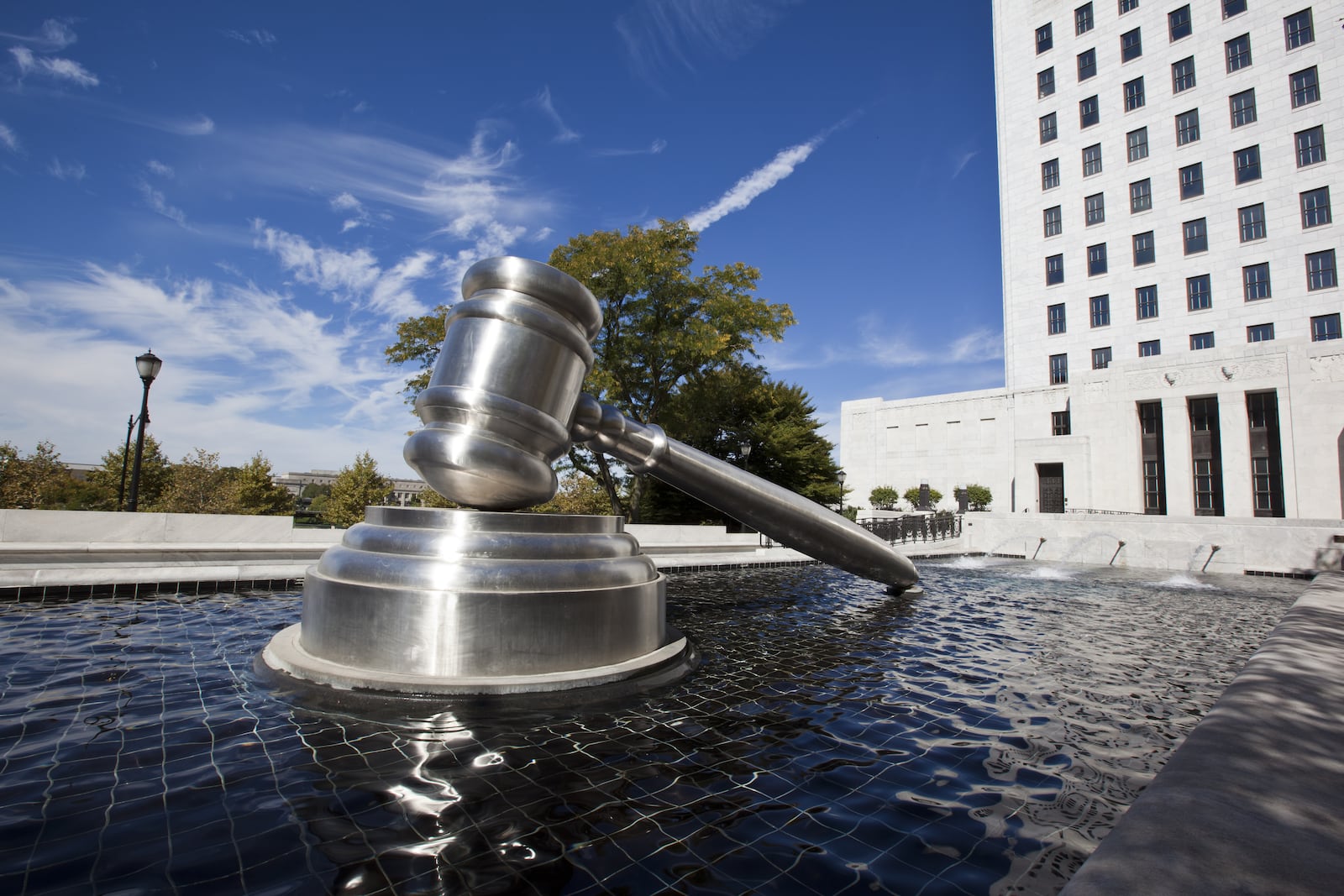 The Gavel Sculpture in downtown Columbus sits in the reflecting pool alongside the Ohio Supreme Court building.