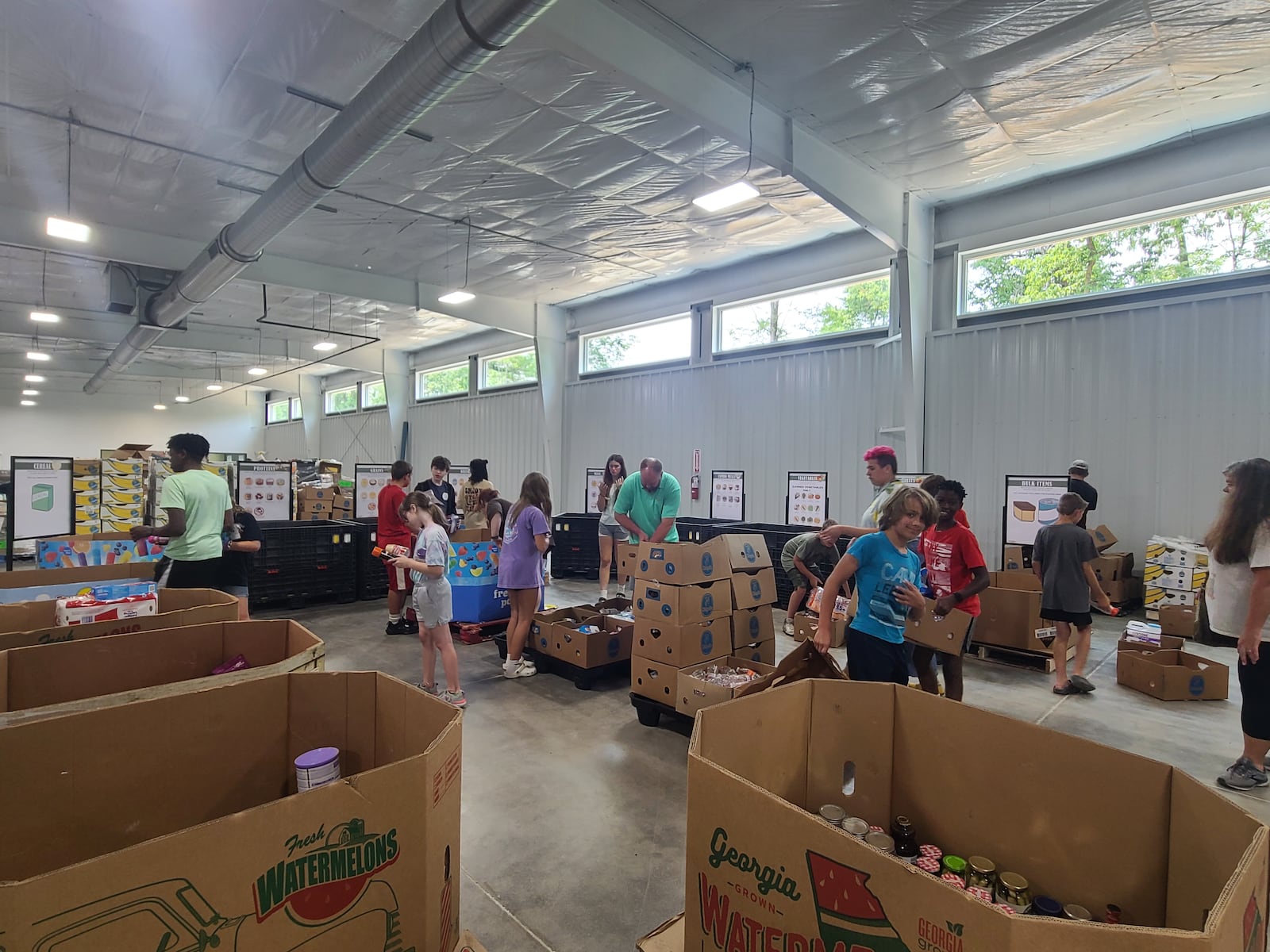 Shared Harvest Foodbank volunteers work in the facility on Dixie Highway. Shared Harvest now has a Hunger Awareness Center to provide temperature-controlled space for volunteers to work. CONTRIBUTED