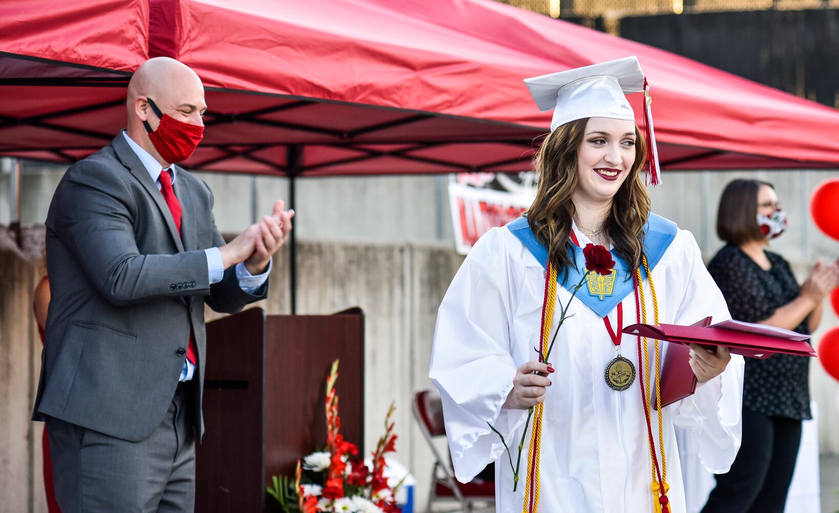 Madison High School drive-thru graduation ceremony at Land of Illusion