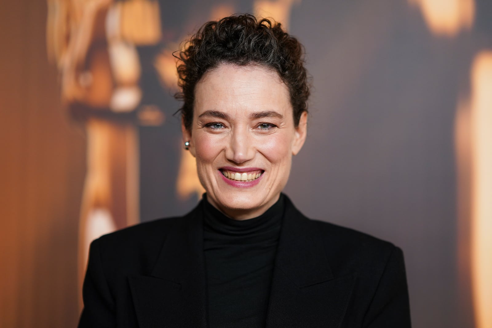 Coralie Fargeat arrives at the Oscars Nominees Dinner on Tuesday, Feb. 25, 2025, at the Academy Museum of Motion Pictures in Los Angeles. (Photo by Jordan Strauss/Invision/AP)