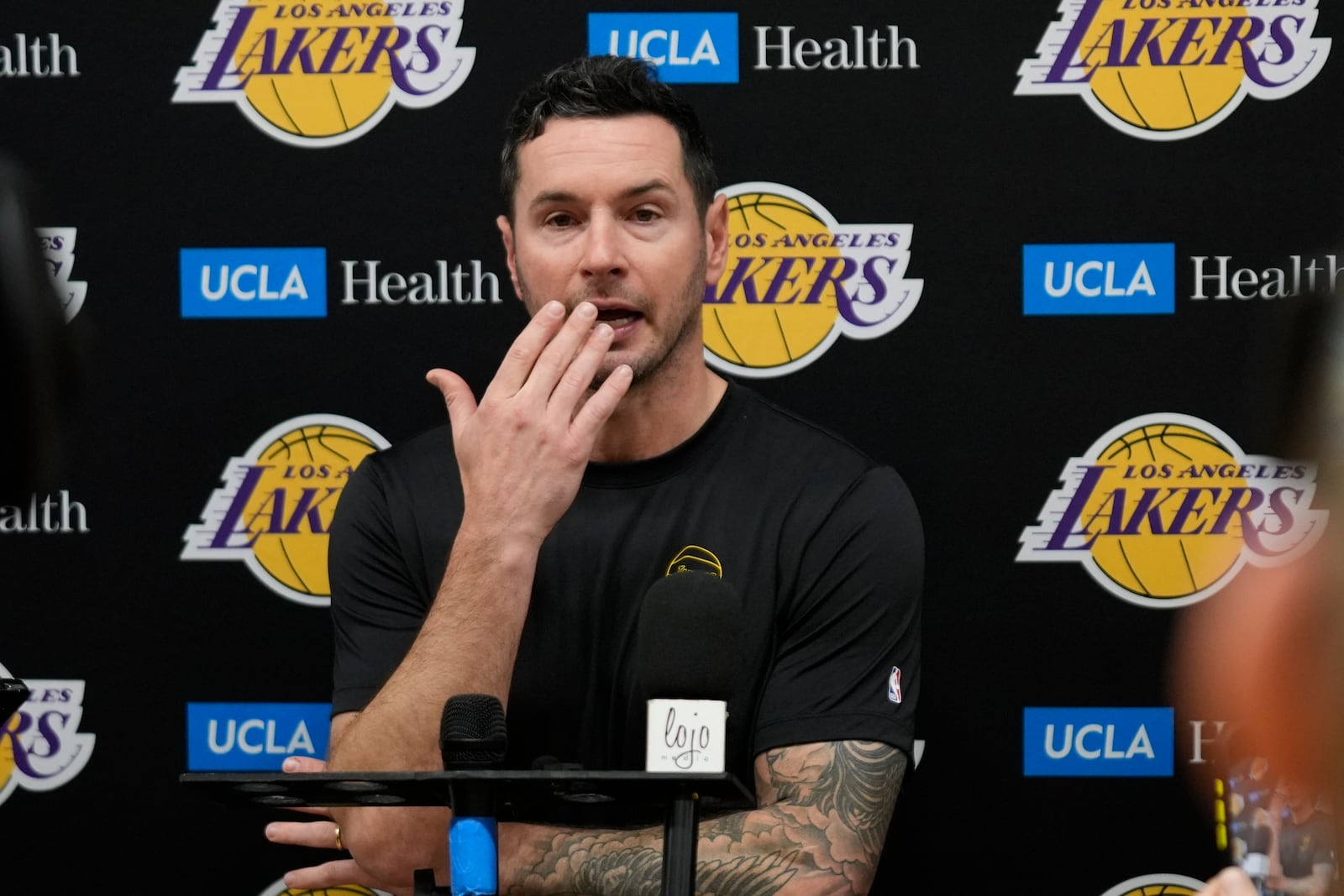 Los Angeles Lakers coach JJ Redick recounts that he and his family lost their house in the deadly Pacific Palisades wildfire during an NBA basketball news conference at the UCLA Health Training Center in El Segundo, Calif., Friday, Jan. 10, 2025. (AP Photo/Damian Dovarganes)