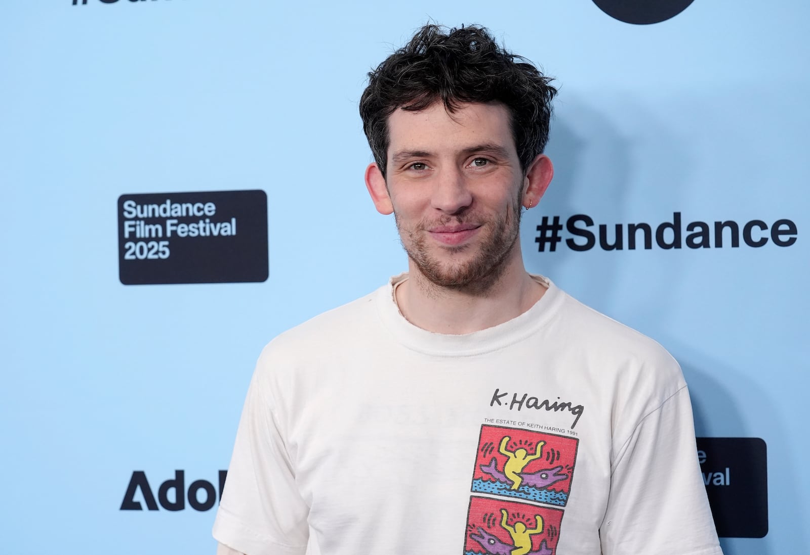 Josh O'Connor, a cast member in "Rebuilding," poses at the premiere of the film during the Sundance Film Festival on Sunday, Jan. 26, 2025, in Park City, Utah. (AP Photo/Chris Pizzello)