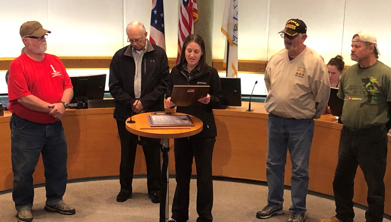 Middletown Mayor Nicole Condrey reads a proclamation during last week's City Council meeting declaring March Vietnam Veterans Day in the city. From left, Mike Gomia, Harvey Poff, Condrey, Paul Hannah and Randy Cornett. RICK McCRABB/STAFF