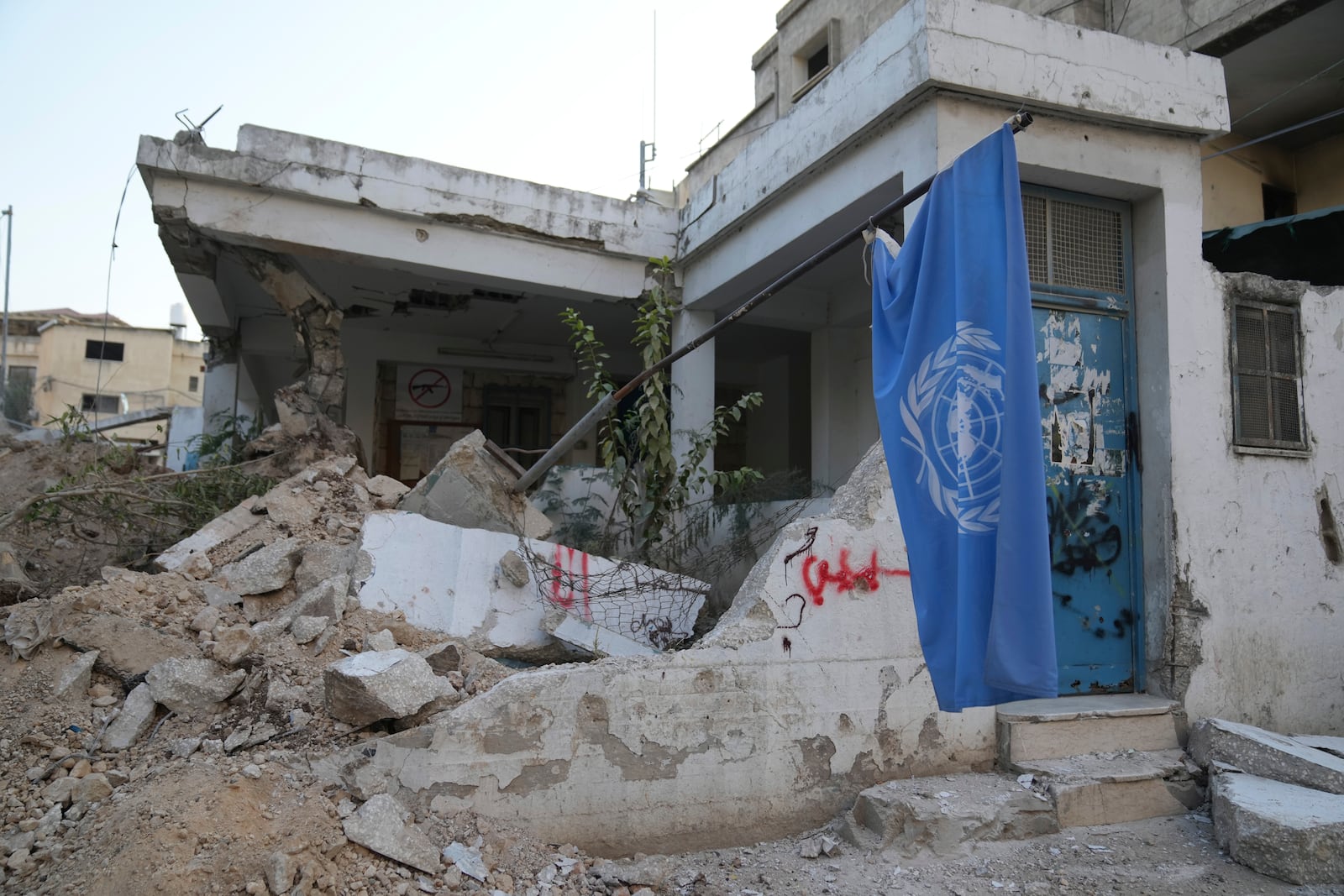 The office of the United Nations for helping Palestinian refugees, UNRWA, that was partly demolished during the Israeli army operation in the West Bank refugee camp of Nur Shams, in Tulkarem Thursday, Oct. 31, 2024. (AP Photo/Nasser Nasser)