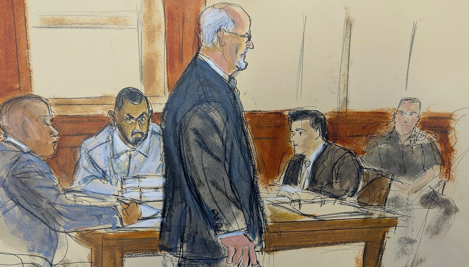 In this courtroom sketch, Hadi Matar, second from left, stares at Salman Rushdie as he walks into court to testify at Chautauqua County Court, Tuesday, Feb. 11, 2025, in Maryville, N.Y. (Elizabeth Williams via AP)