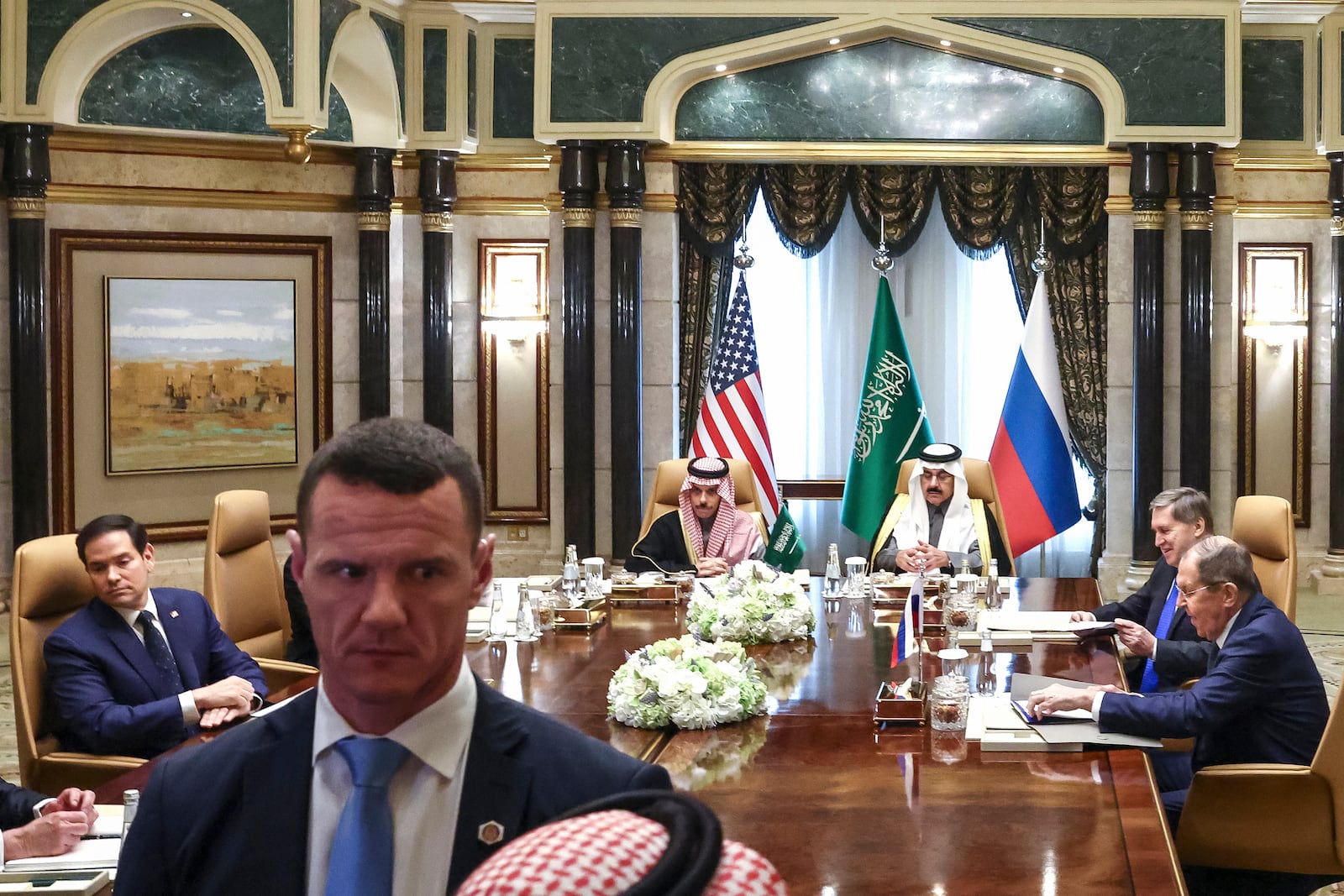 U.S. Secretary of State Marco Rubio, left, Saudi Foreign Minister Prince Faisal bin Farhan Al Saud, Saudi National Security Advisor Mosaad bin Mohammad Al-Aiban, Russian Foreign Minister Sergei Lavrov, right, and Russian President Vladimir Putin's foreign policy advisor Yuri Ushakov, second right, attend their meeting at Diriyah Palace, in Riyadh, Saudi Arabia, Tuesday Feb. 18, 2025. (Evelyn Hockstein/Pool Photo via AP)