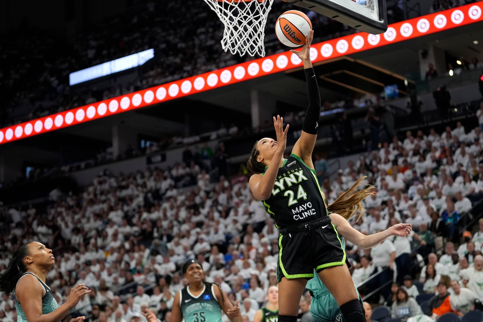 Minnesota Lynx forward Napheesa Collier (24) drives to the basket during the second half against the New York Liberty in Game 3 of a WNBA basketball final playoff series, Wednesday, Oct. 16, 2024, in Minneapolis. (AP Photo/Abbie Parr)