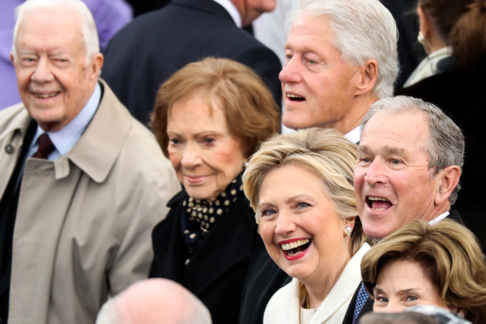 FILE - Hillary Clinton smiles wide as she and former President Jimmy Carter, from left, former first lady Rosalynn Carter, former President Bill Clinton, former President George W. Bush, and former first lady Laura Bush wait for the start of the inauguration ceremony to swear President-elect Donald Trump as the 45th president of the United States, at the Capitol in Washington, Jan. 20, 2017. (AP Photo/Andrew Harnik, File)